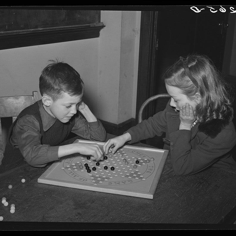 Children playing Chinese checkers, 1940s
