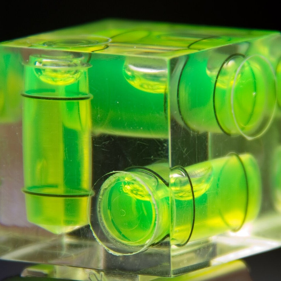 A spirit level with glowing vials