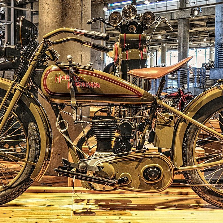 A vintage olive-green Harley-Davidson motorcycle