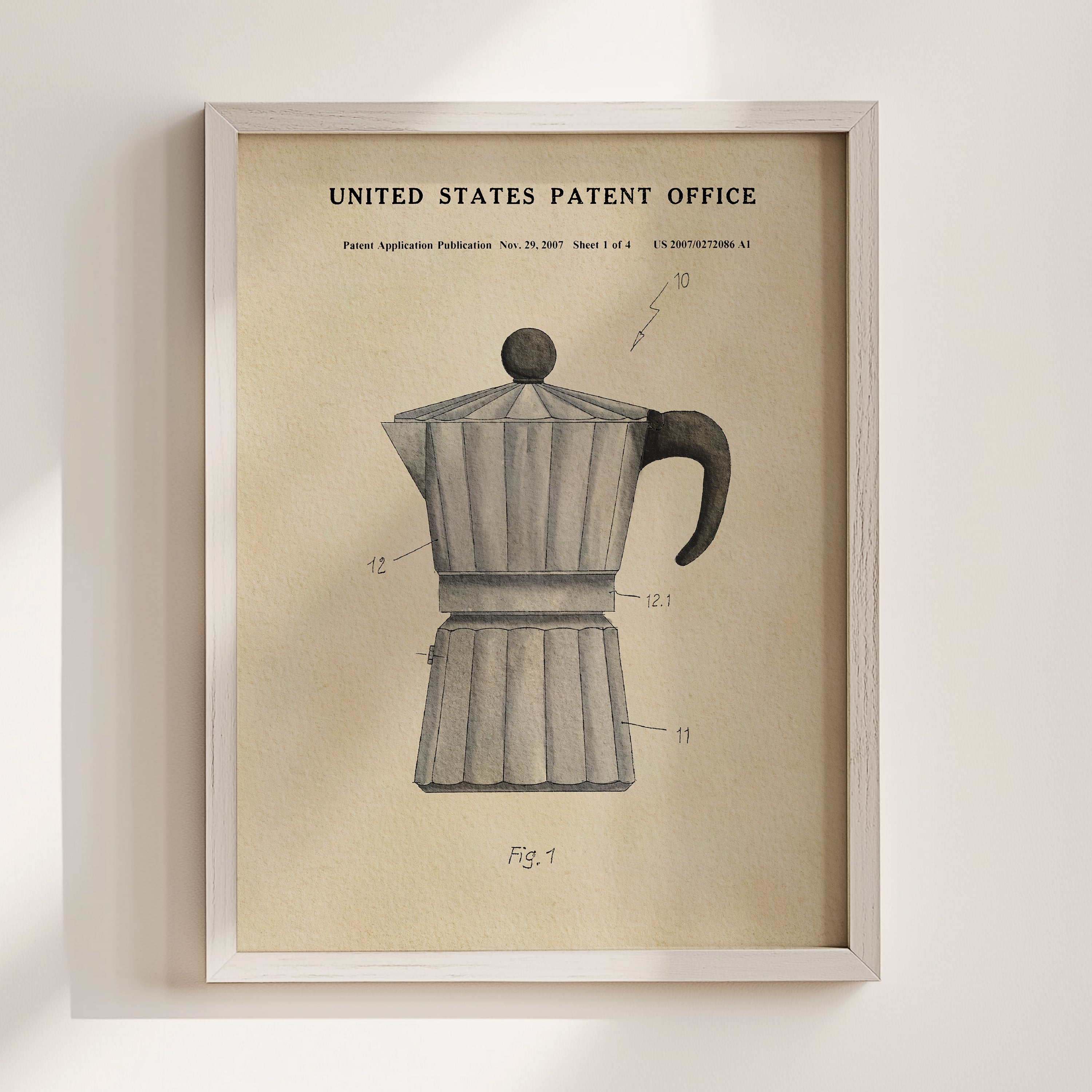 The image is a framed vintage patent drawing of a coffee maker, depicting the design and features of the device.