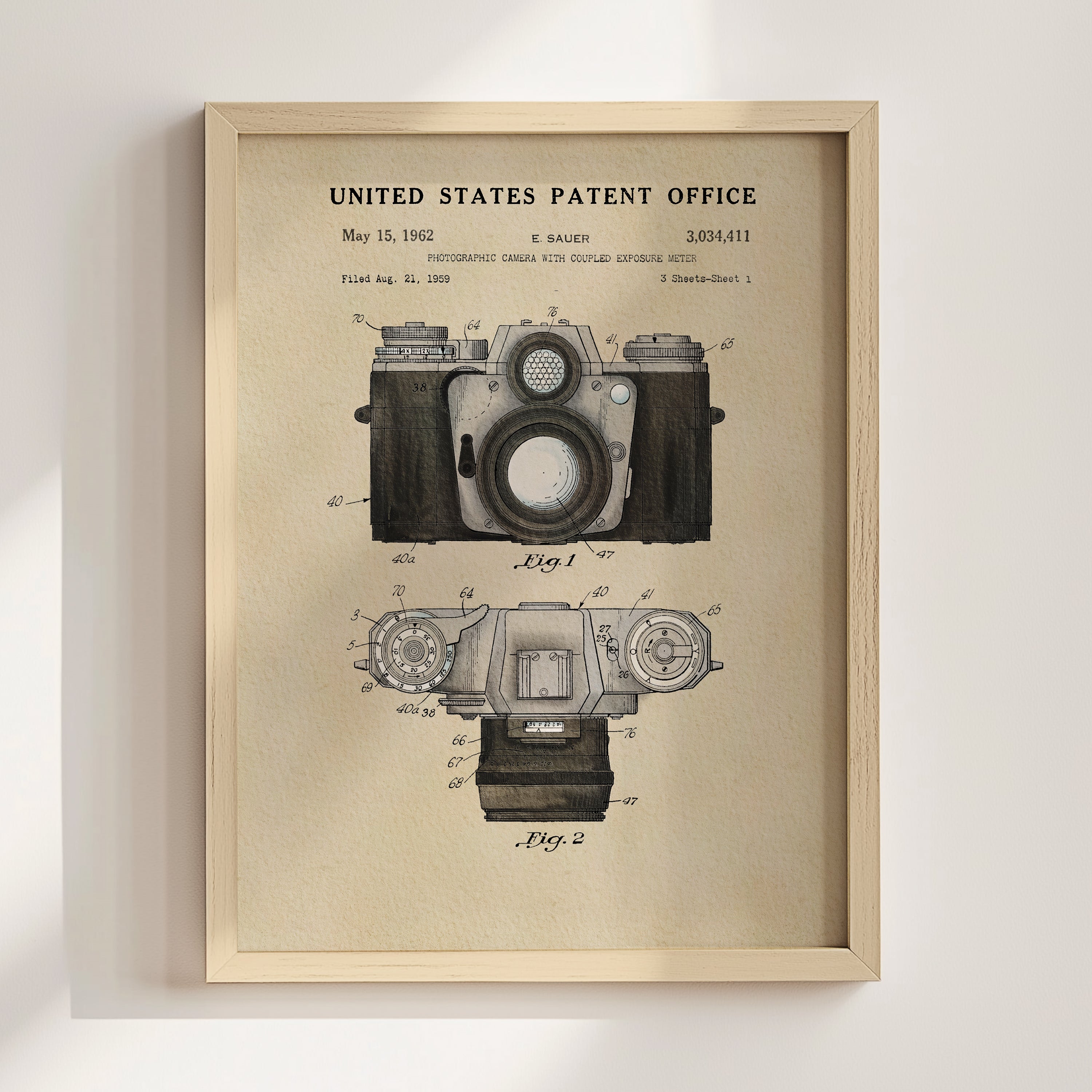 The image is a framed patent drawing of a camera, depicting the design and features of the camera in a technical drawing style.