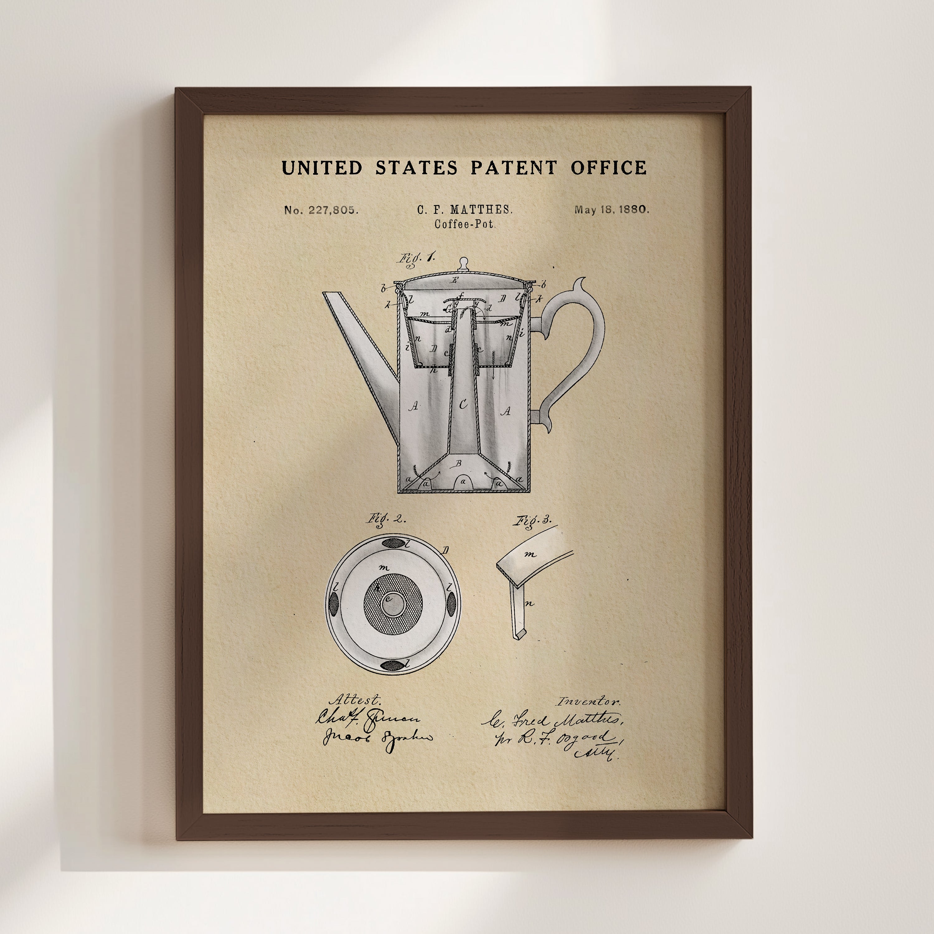The image is a framed patent drawing of a coffee pot, depicting the design and features of the product.