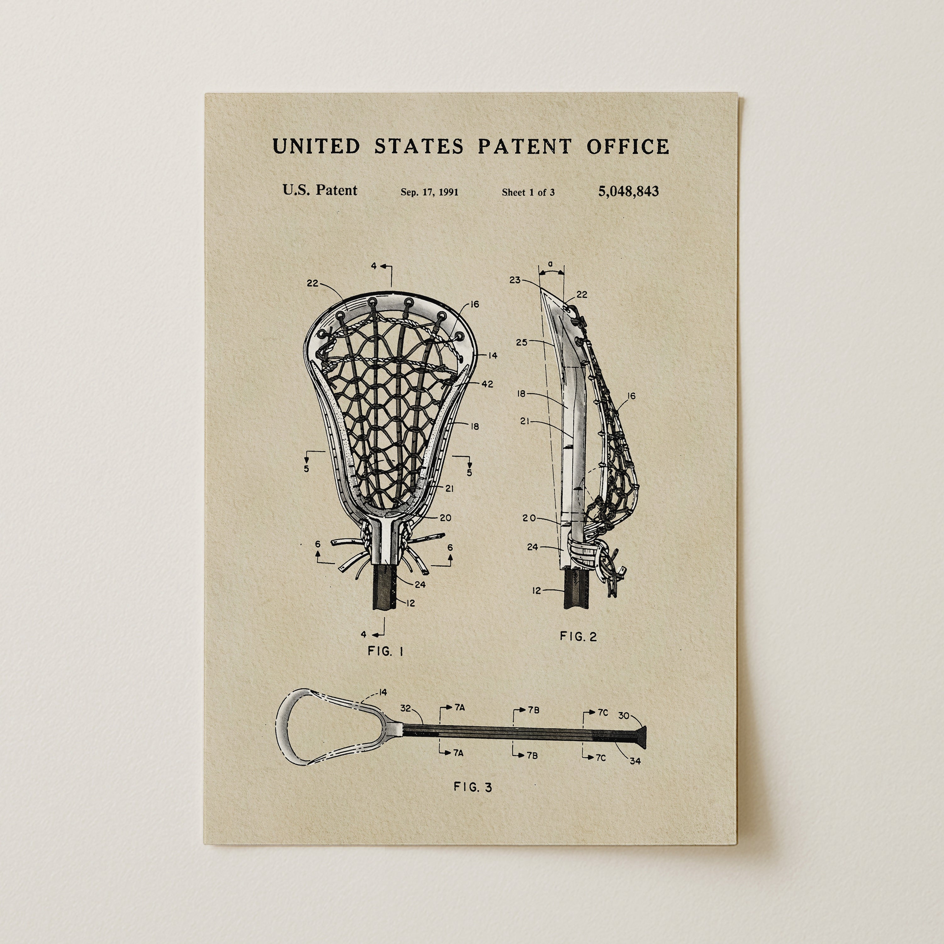 The image is a patent drawing of a lacrosse stick, depicting the design and structure of the lacrosse stick in a technical drawing format.