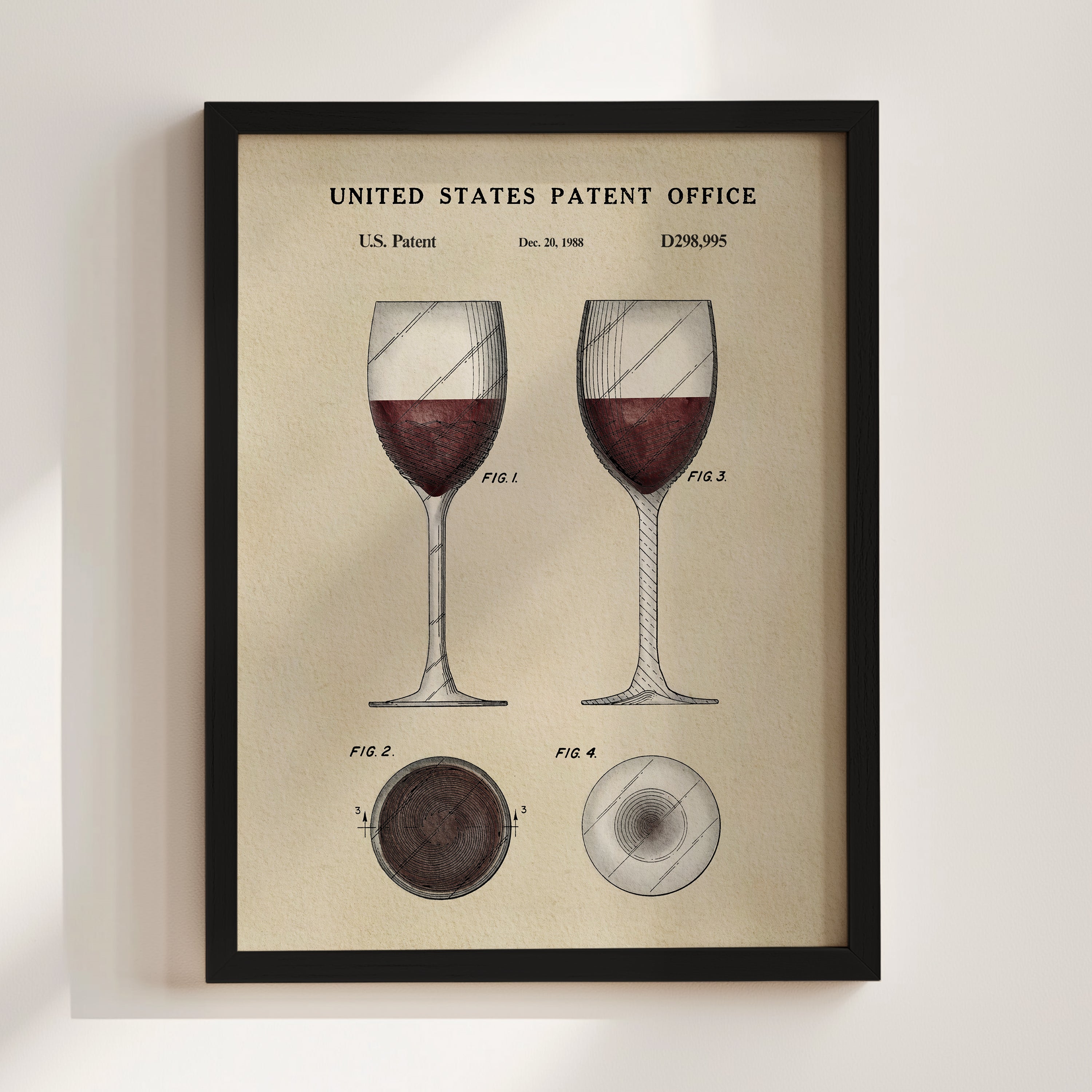 The image is a framed print depicting a wine glass with a detailed illustration of the glass and its contents, along with patent drawings and text.