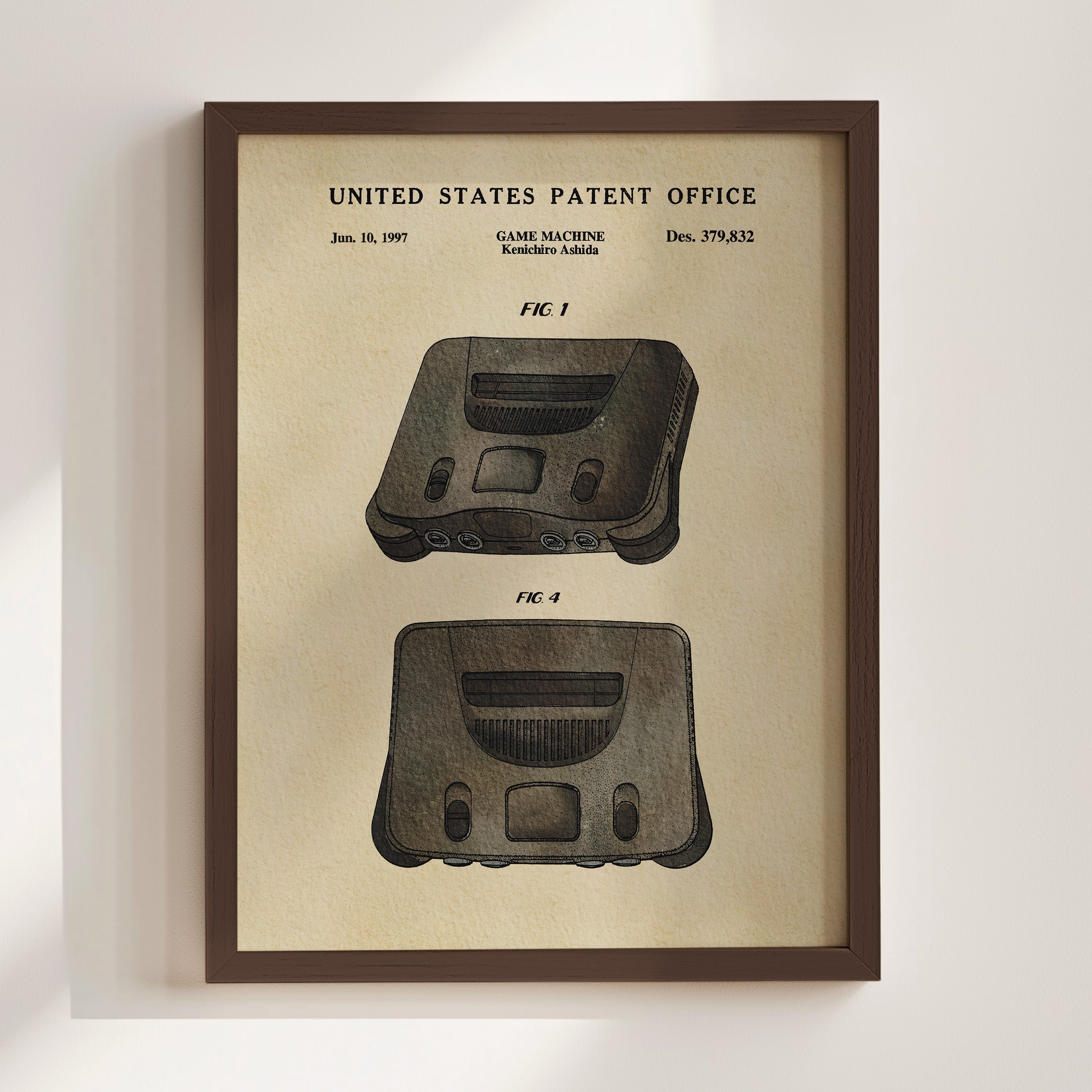 The image is a framed patent drawing of a game machine, specifically the Kenchiro Ashida console, from the United States Patent Office.