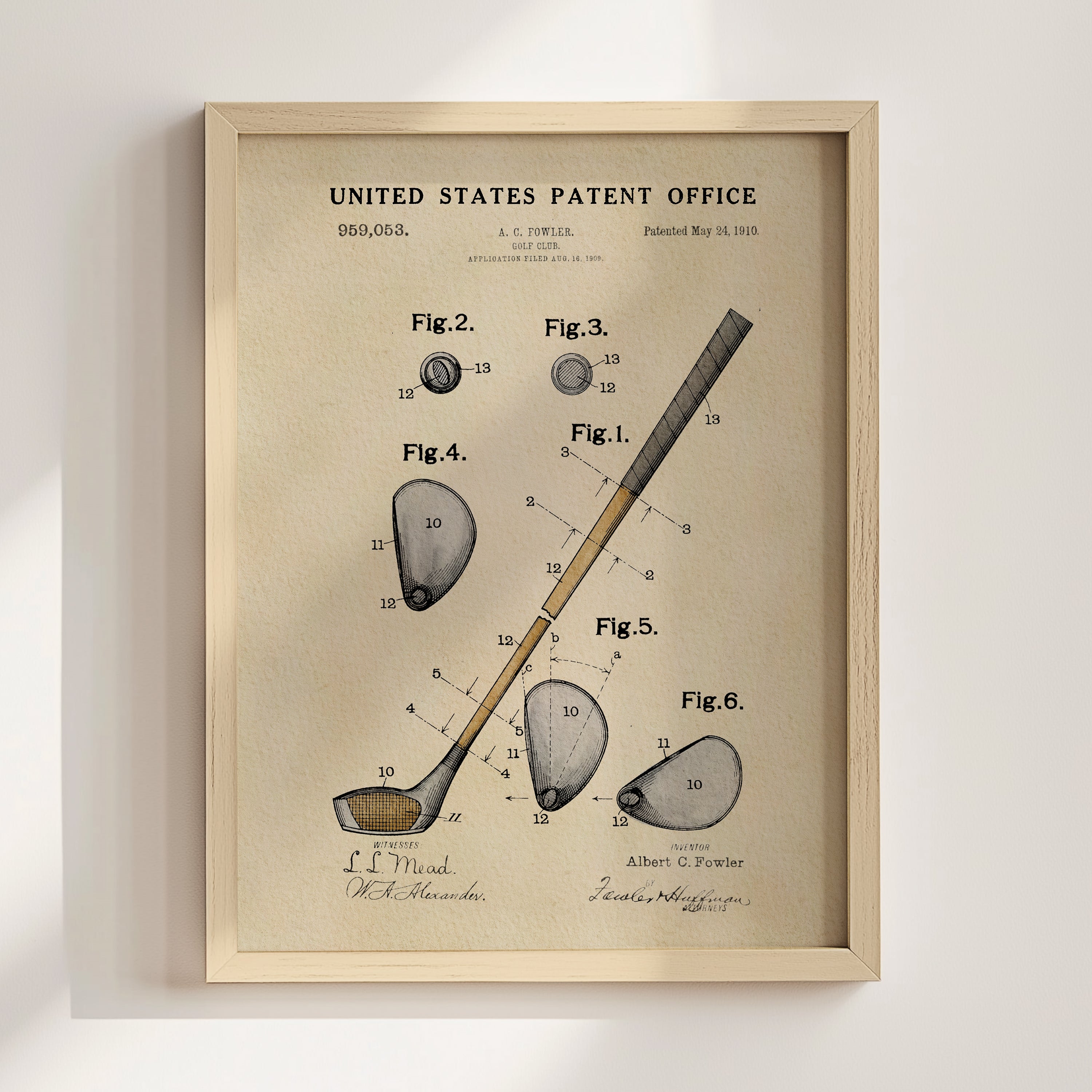 The image is a framed vintage patent drawing depicting a golf club and its components, including the club head, shaft, and other parts.