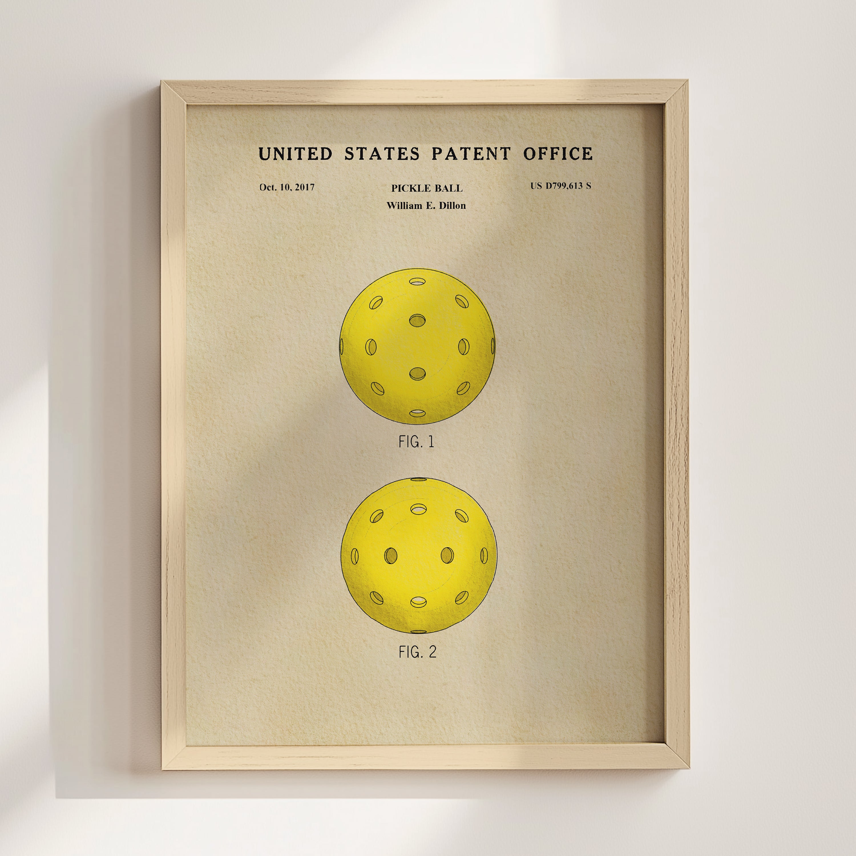 The image is a framed print of a patent drawing for a paddle ball, featuring two illustrations of the ball.