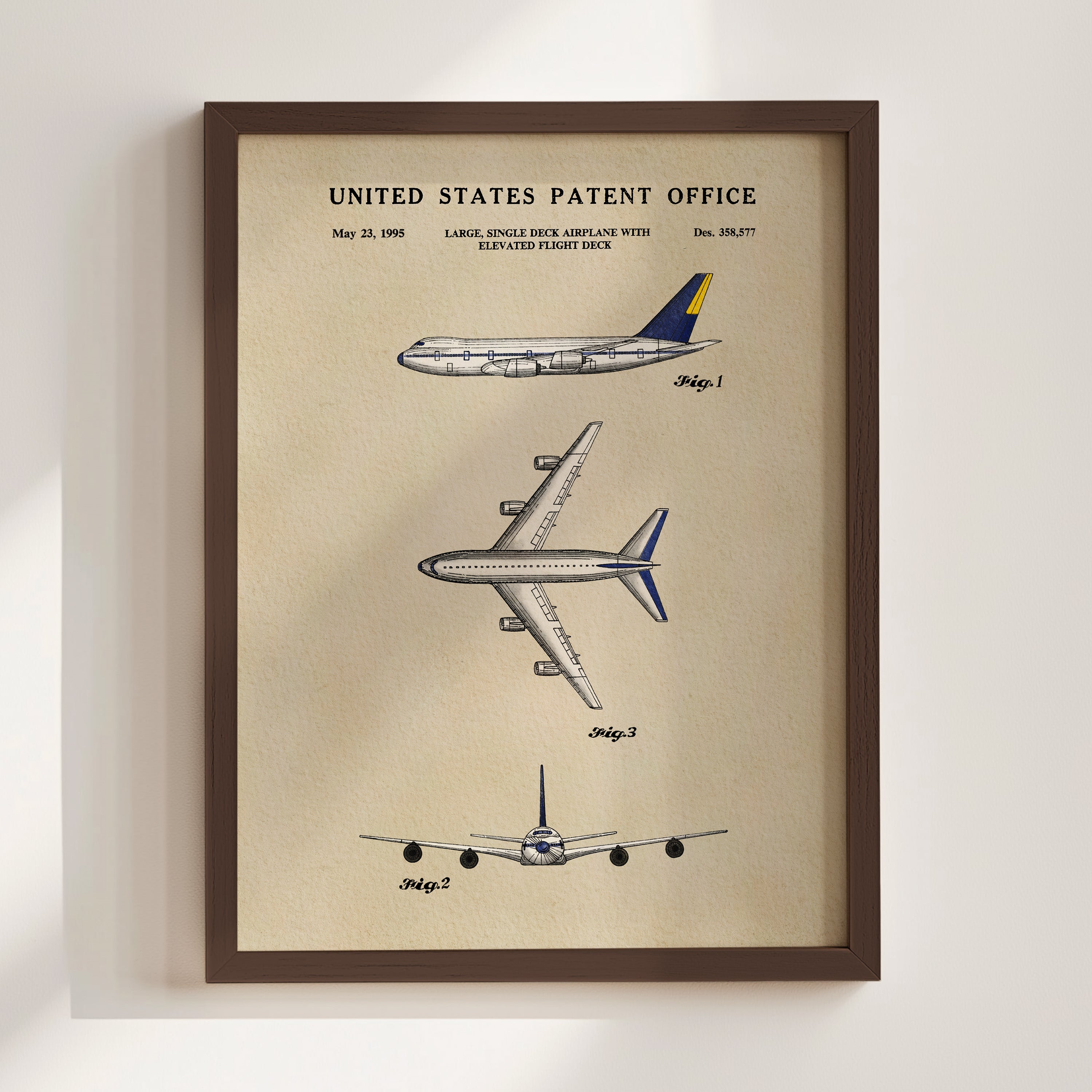 The image is a framed patent drawing depicting three different airplanes, including a large single-engine aircraft with an elevated flight deck.