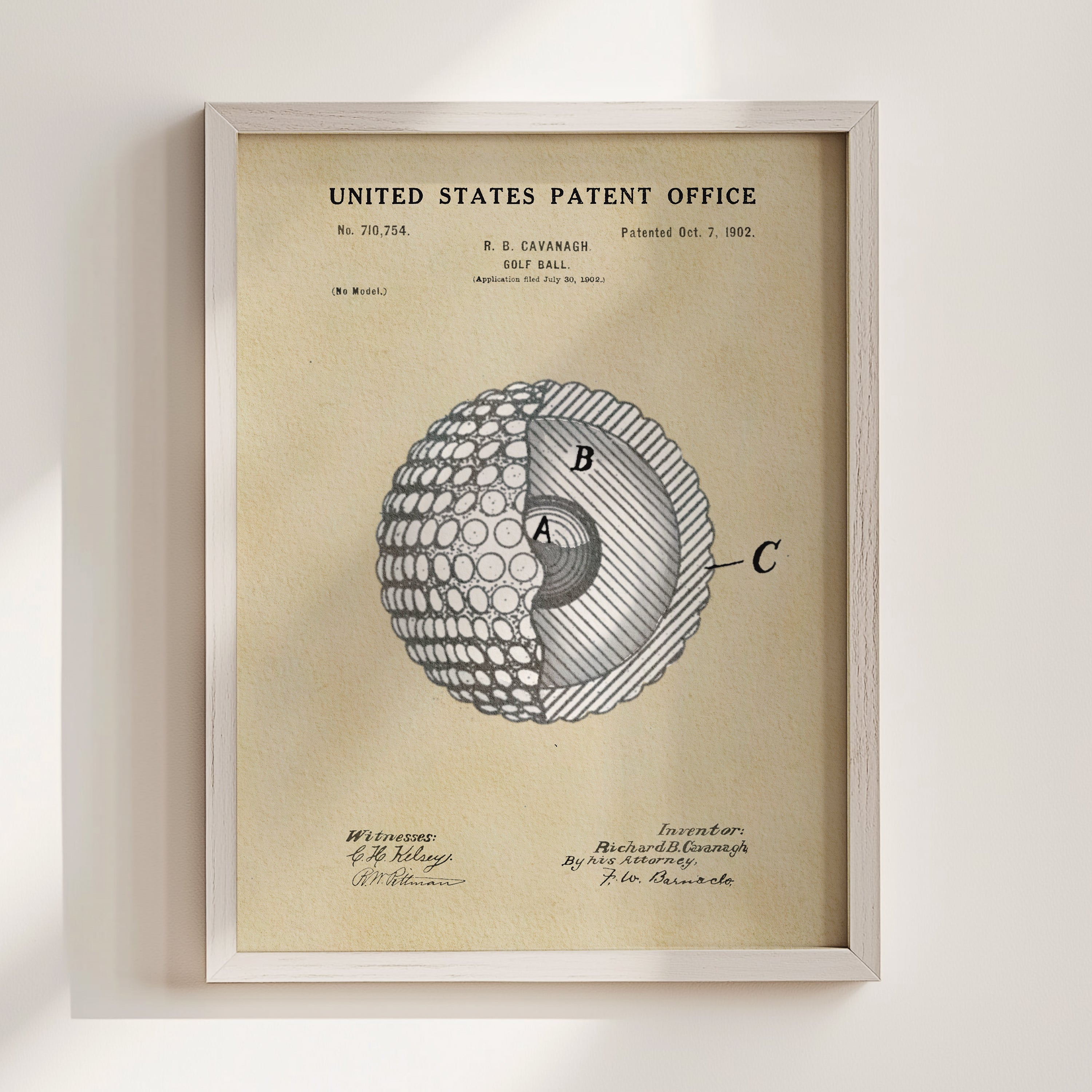 The image is a framed patent drawing depicting a golf ball with a cross-section view, showing the inner structure of the ball.