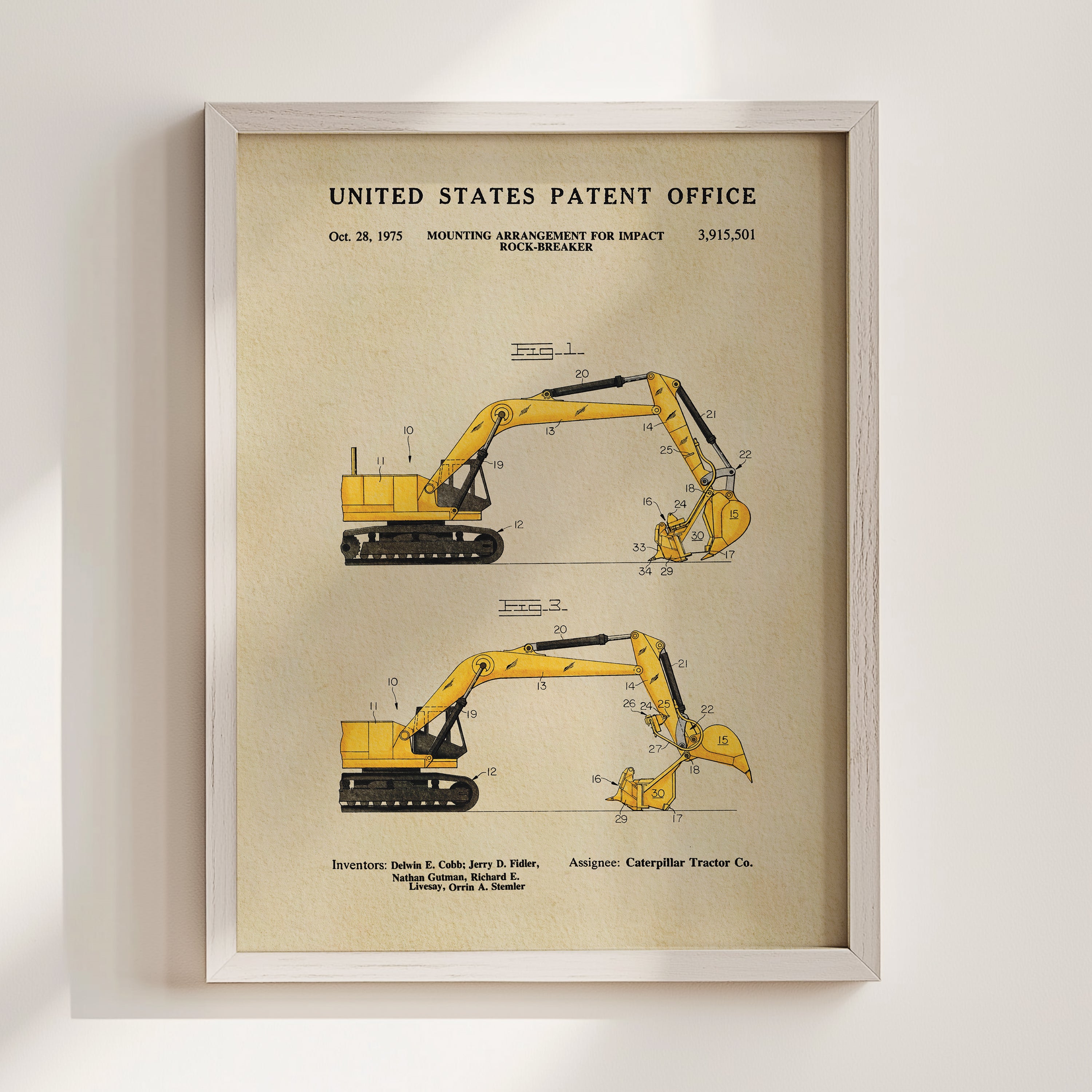 The image is a framed patent illustration depicting two yellow construction vehicles, likely a backhoe or excavator, with detailed technical drawings and measurements.