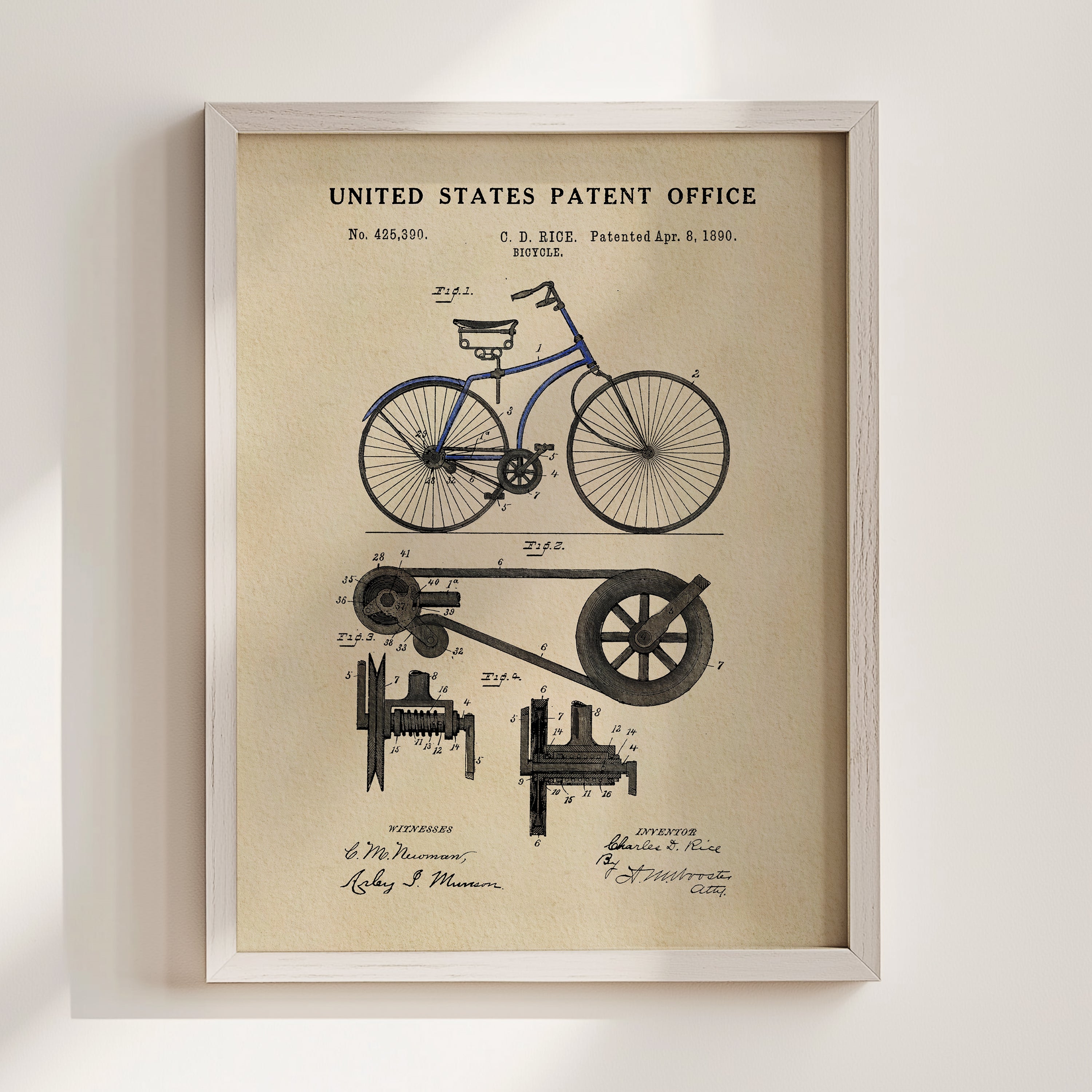The image is a framed vintage patent drawing of a bicycle, depicting the design and construction of the bicycle.