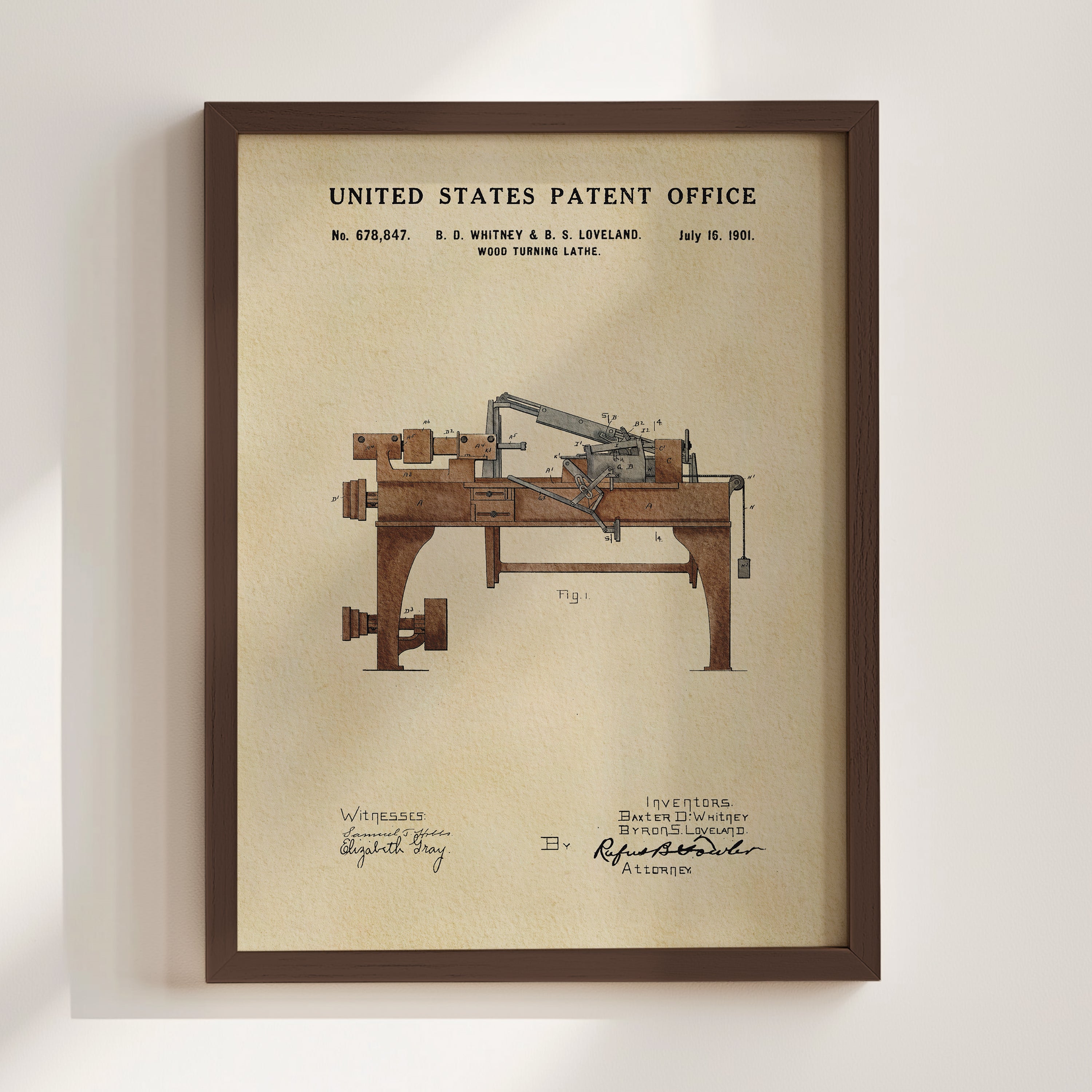 The image is a framed patent drawing of a wood turning lathe, depicting the invention by B. E. Whitney & S. Lovland on July 16, 1901.