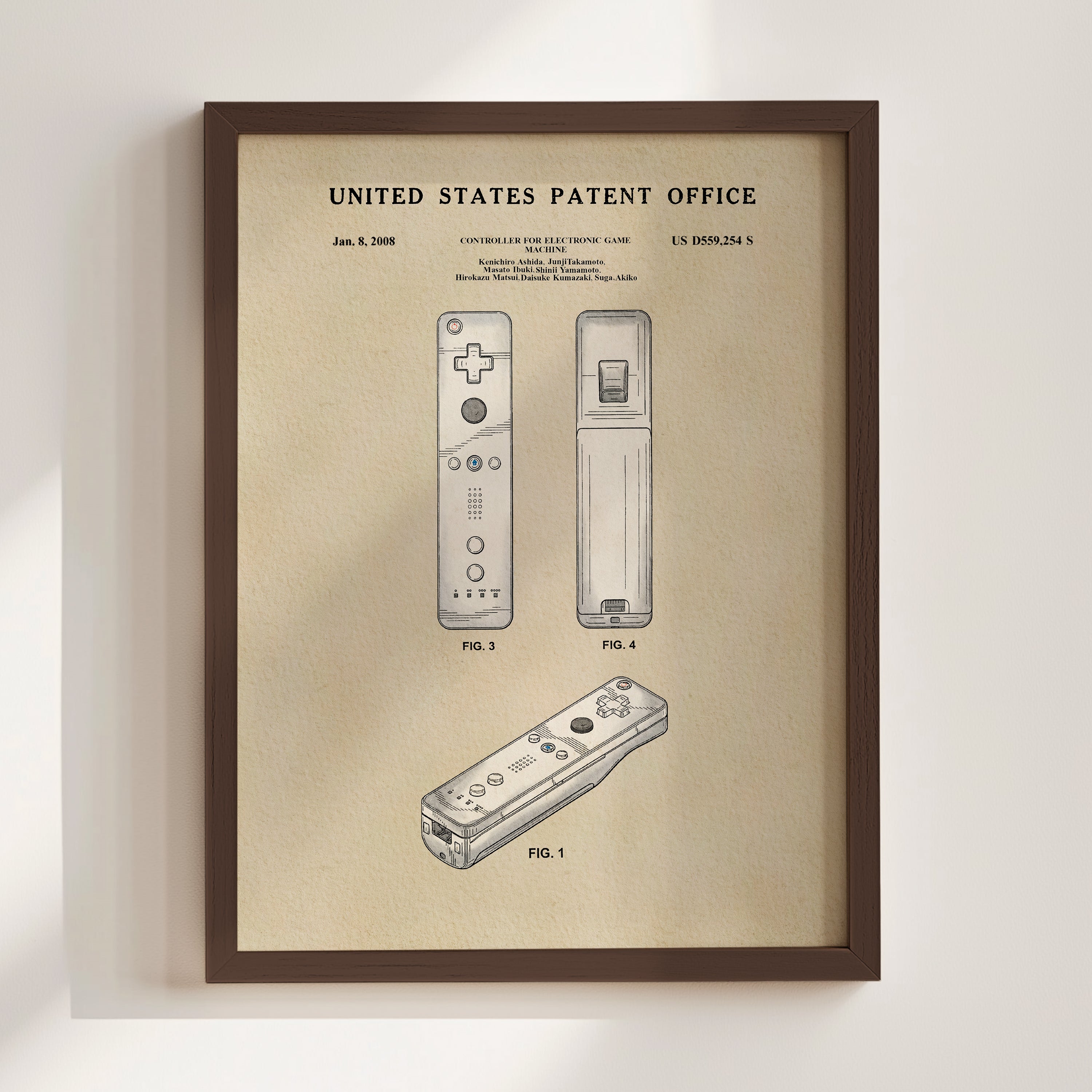 The image is a framed patent drawing depicting two Wii controllers and a Wii remote, with the United States Patent Office's patent office label at the top.