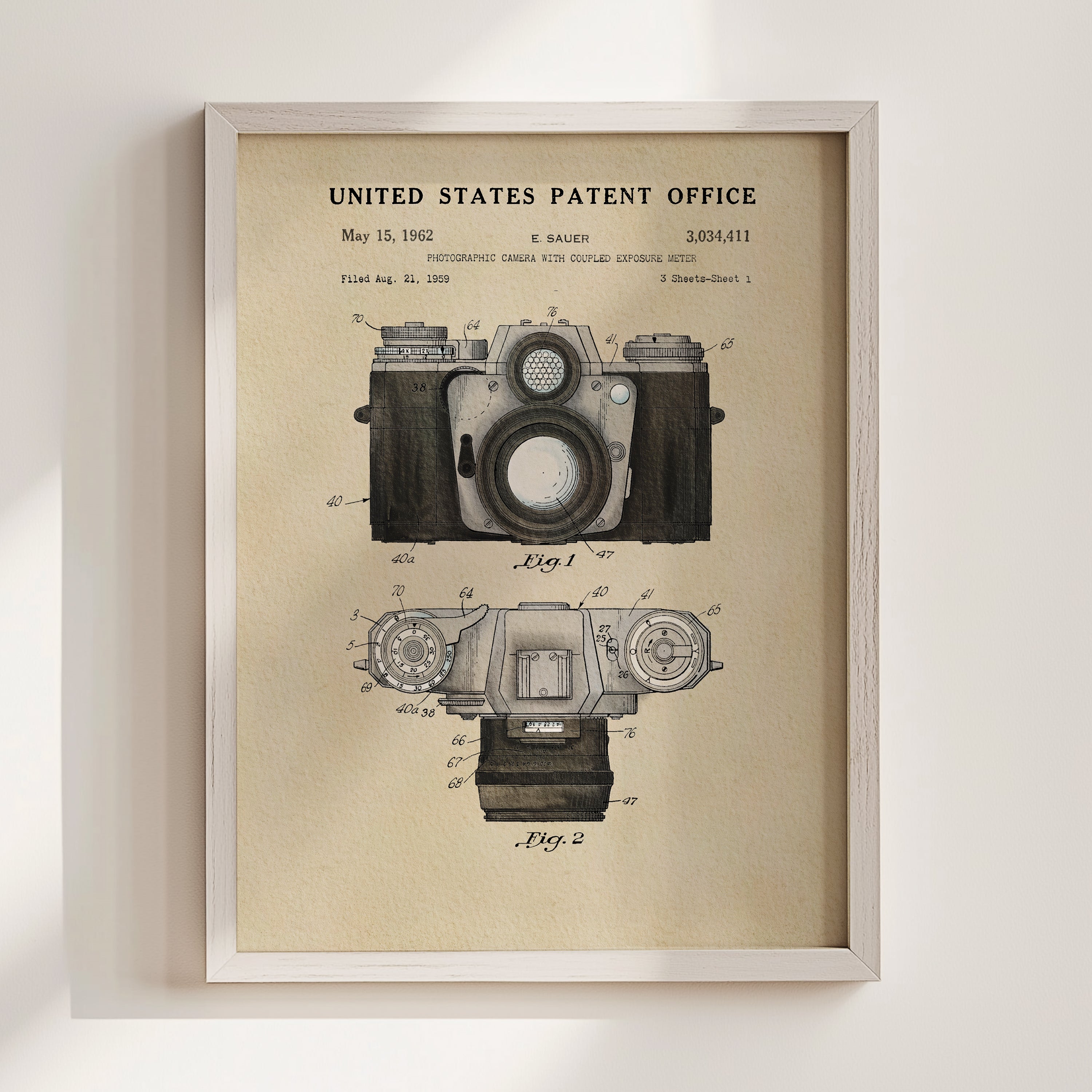 The image is a framed vintage patent drawing of a camera, depicting the design and features of the camera in a technical drawing style.