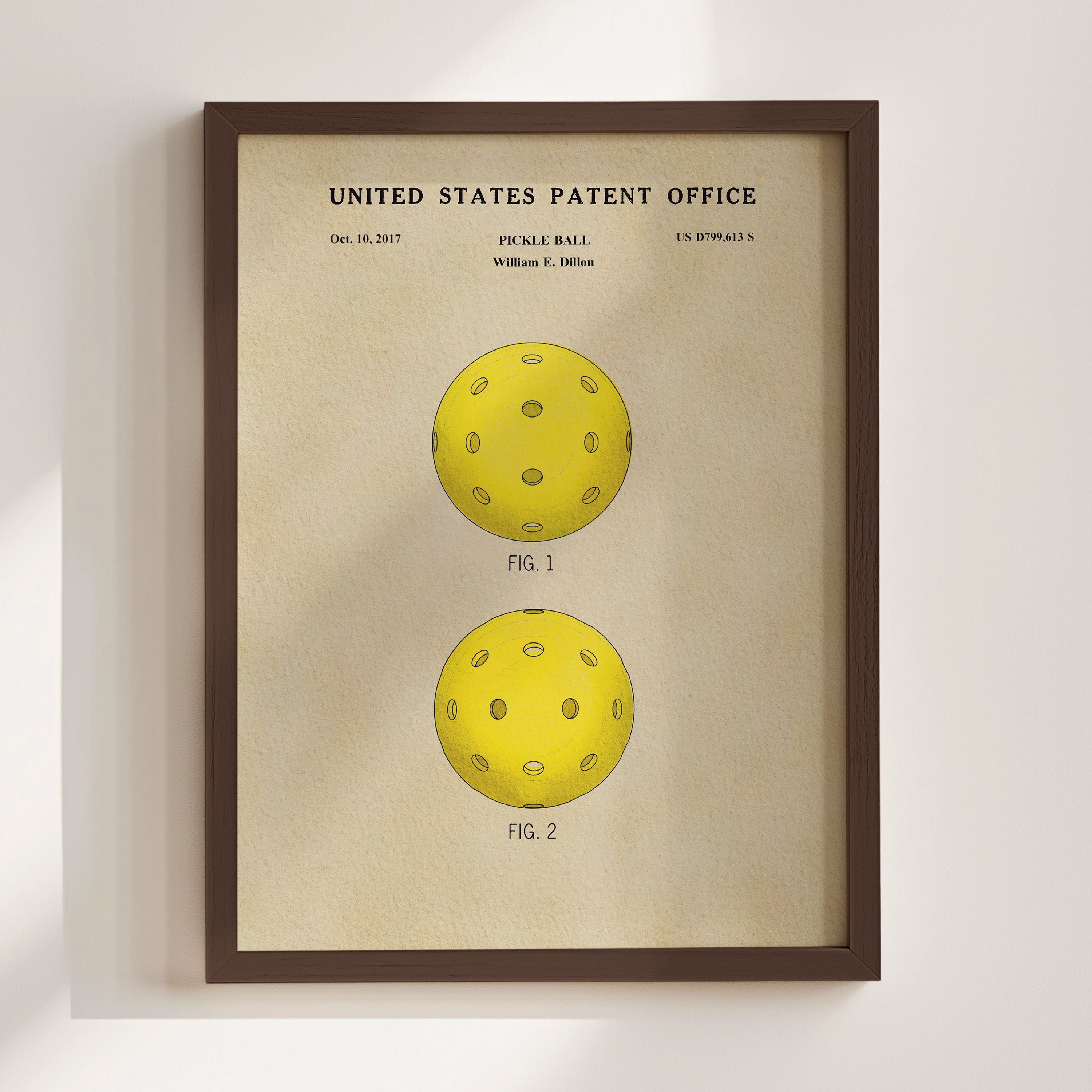 The image is a framed print of a patent application for a paddle ball, featuring two illustrations of the paddle ball.