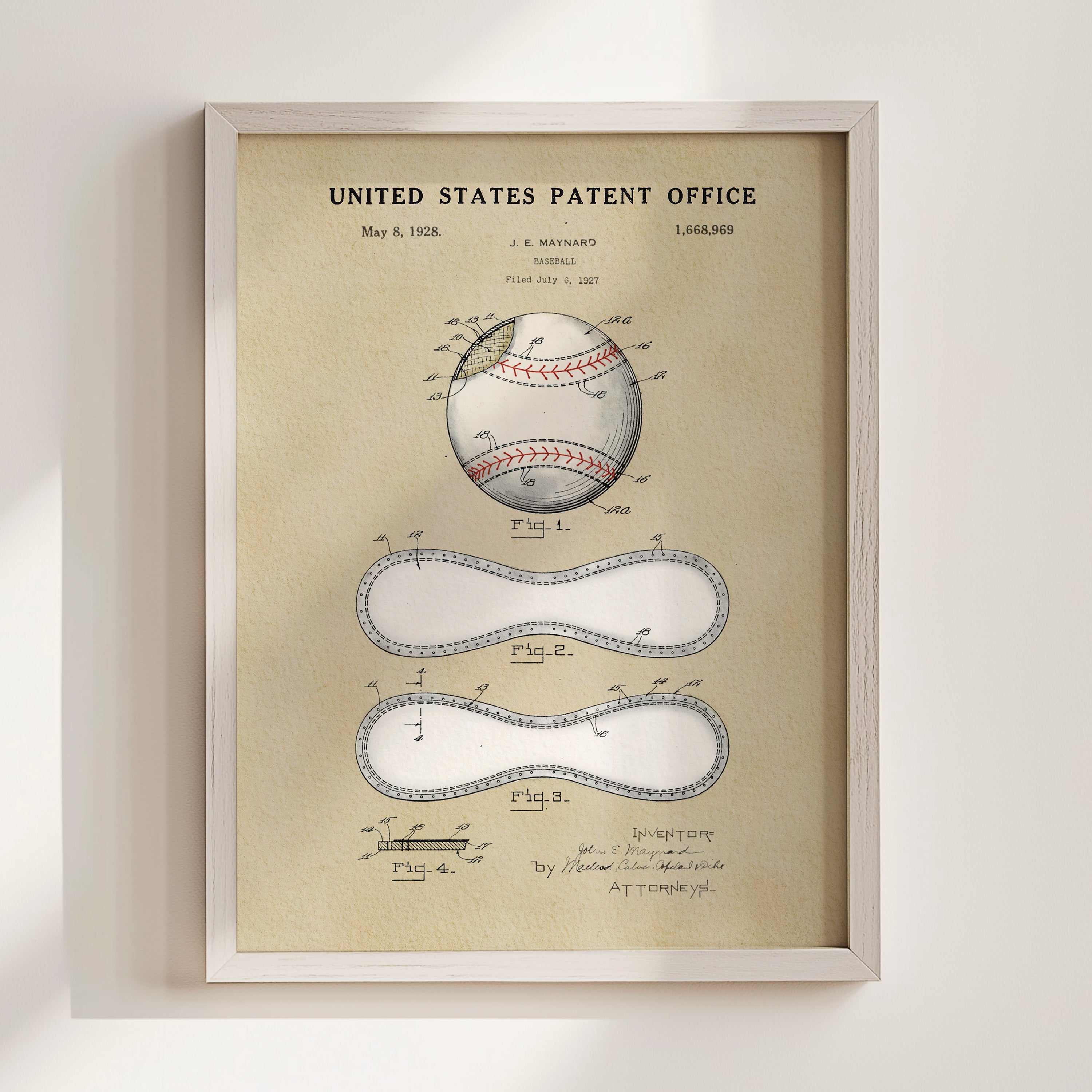 The image is a framed vintage patent drawing of a baseball, featuring detailed drawings and labels.