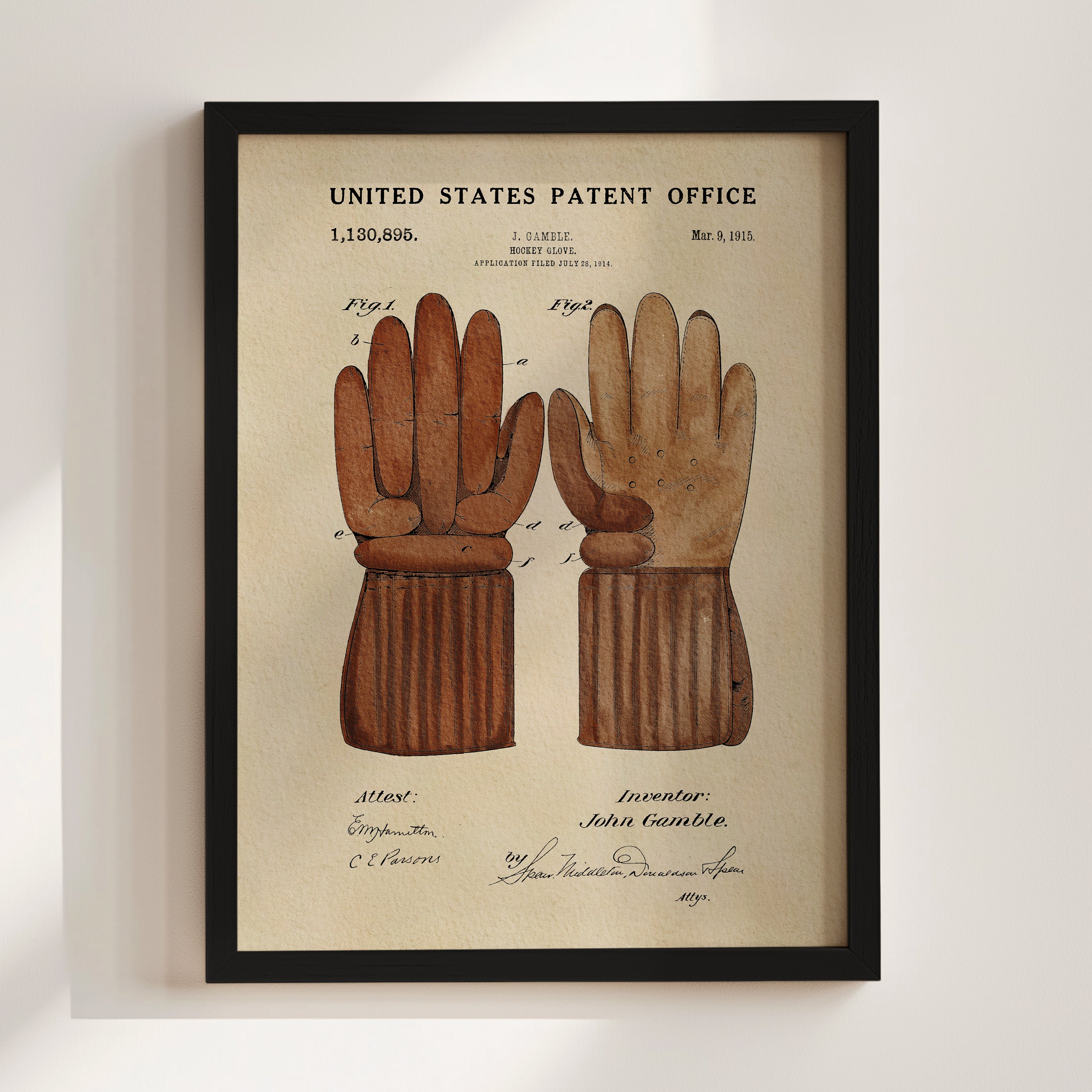 The image is a framed patent drawing depicting a pair of brown gloves, likely intended as a reference or inspiration for a new invention.