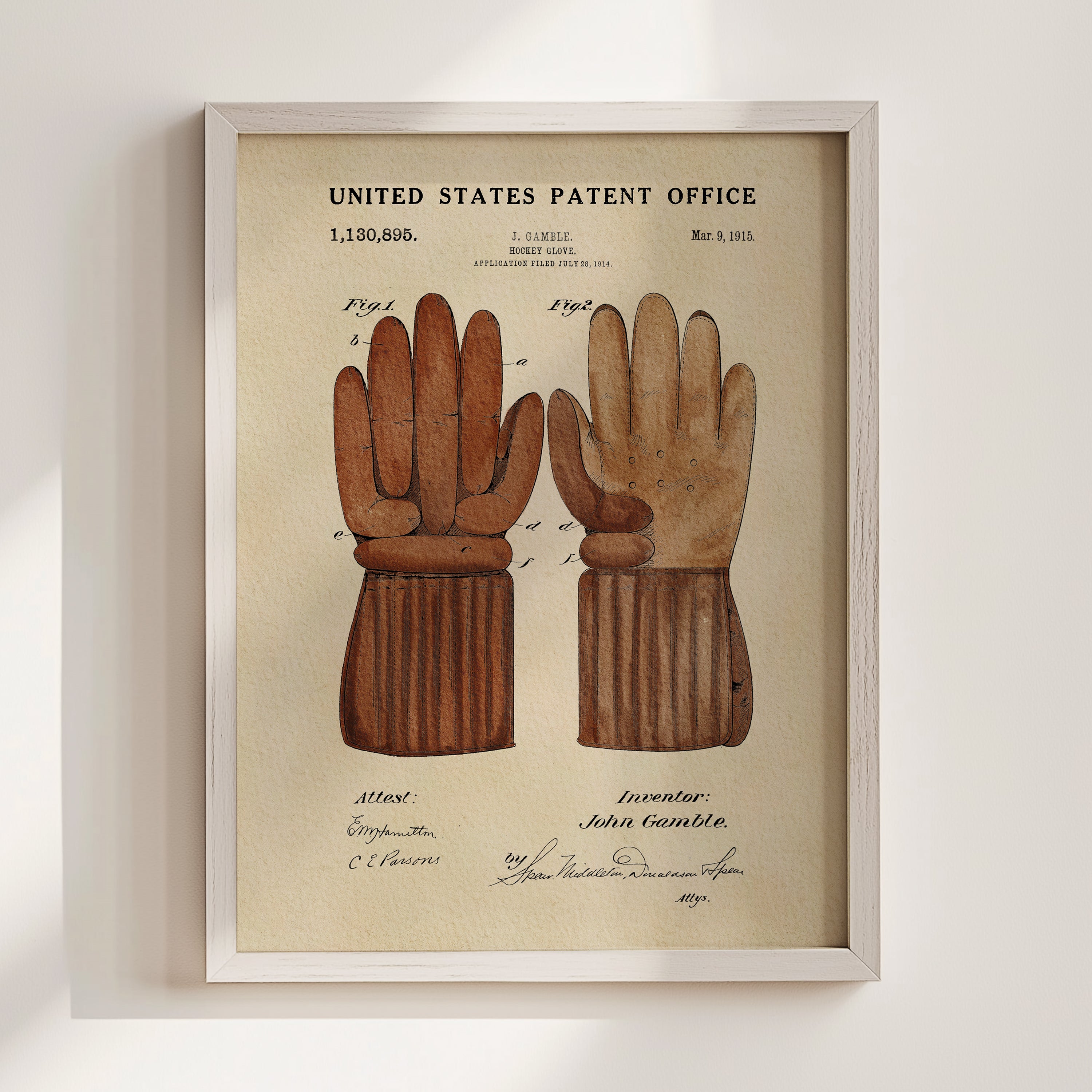 The image is a framed patent drawing depicting a pair of brown gloves, likely intended as a design for a glove or glove-like device.