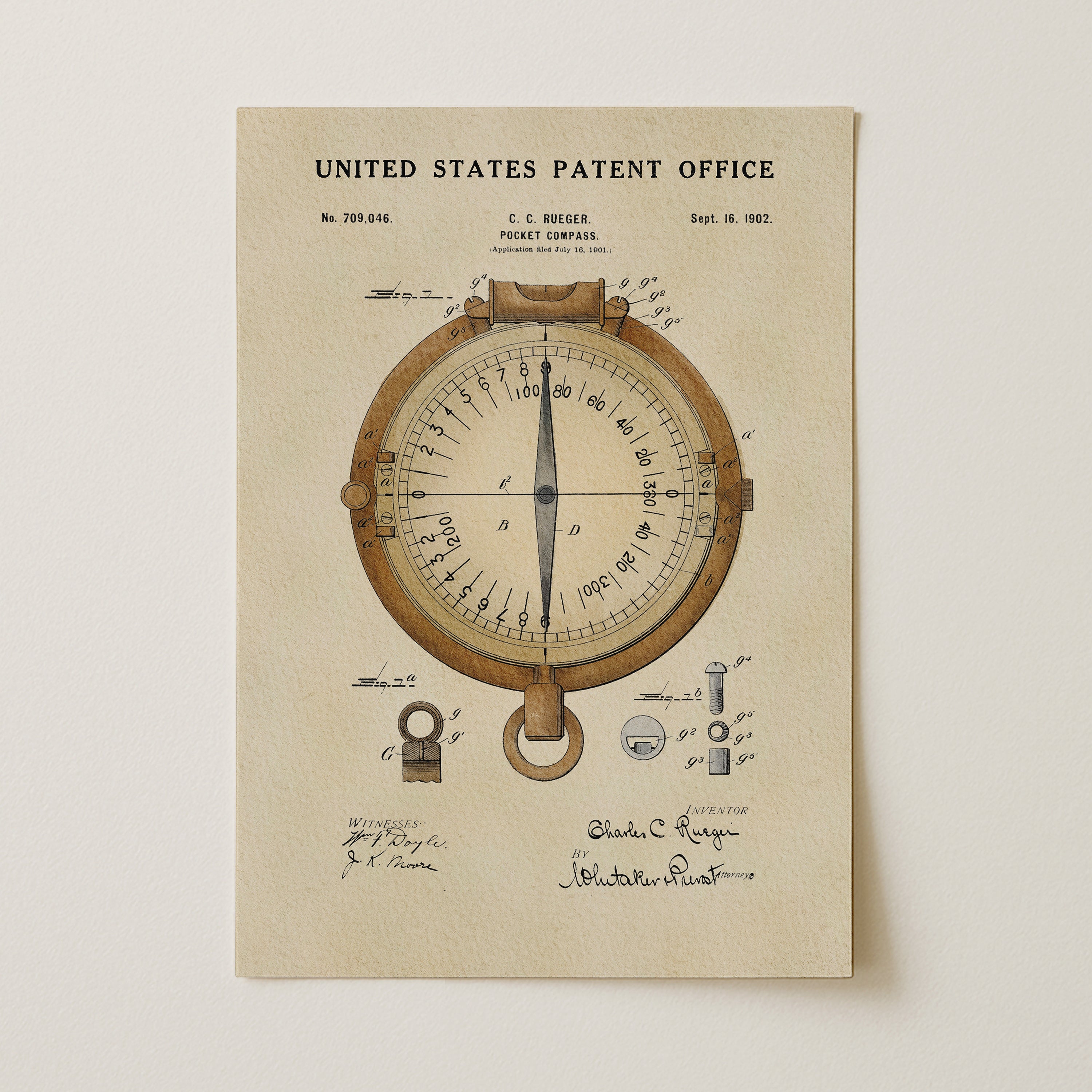 The image is a patent drawing of a compass, featuring detailed technical drawings and annotations.