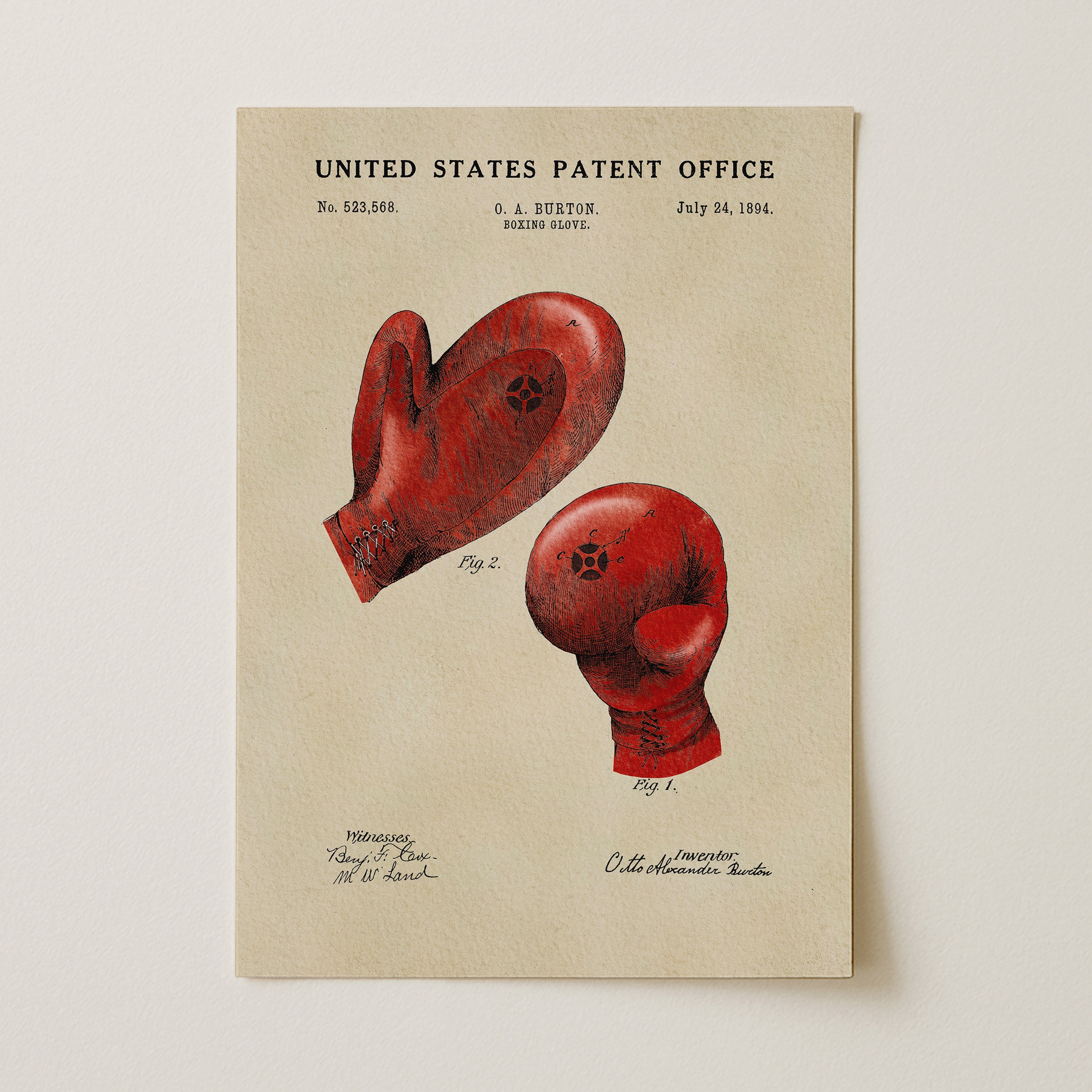 The image is a patent drawing of boxing gloves, depicting two red gloves with a star symbol on them.