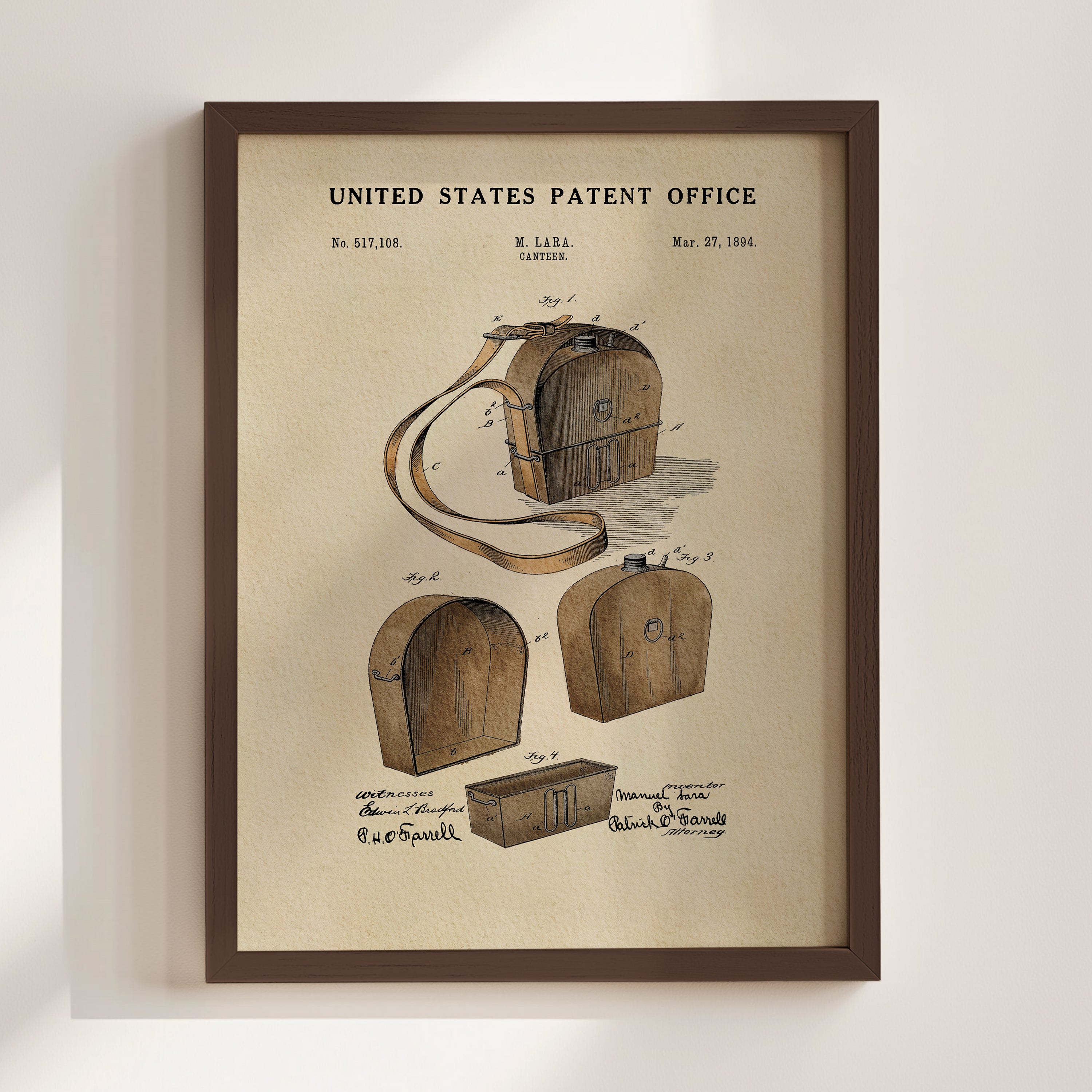 The image is a framed vintage patent drawing depicting a wooden bag or briefcase with a handle and straps.