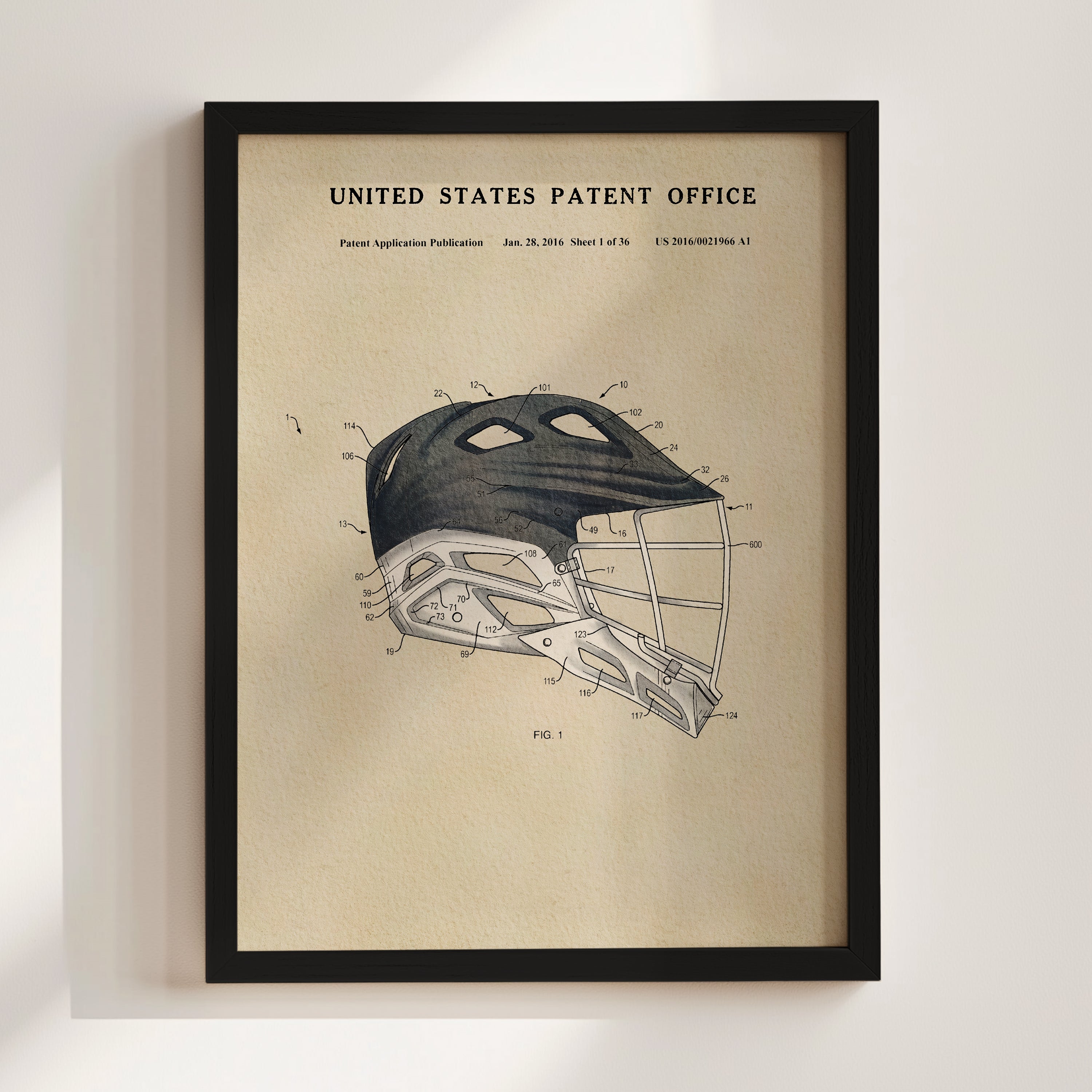 The image is a framed print of a patent application for a sports helmet, specifically a lacrosse helmet.