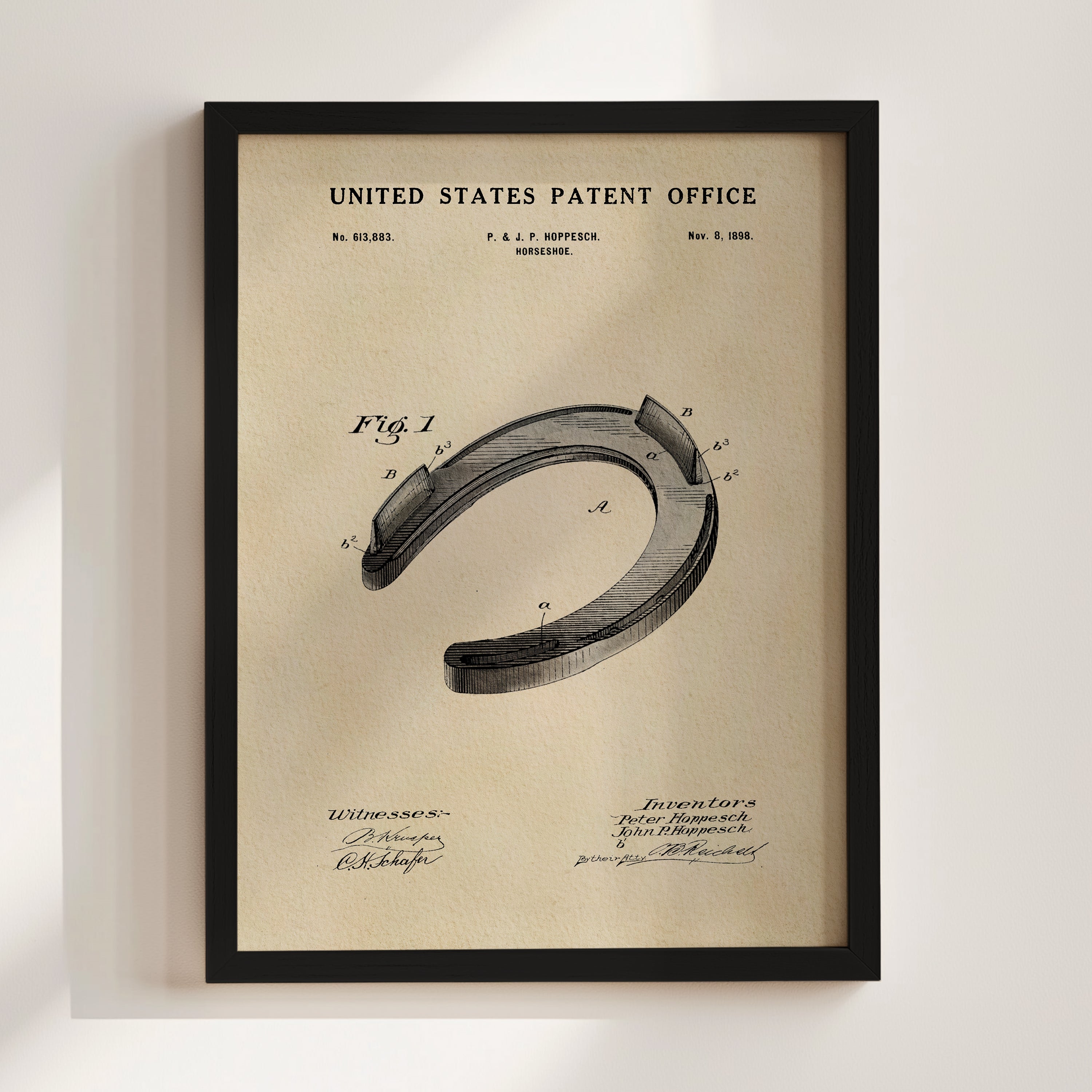 The image is a framed vintage patent drawing of a horseshoe, depicting the design and construction of the horseshoe.