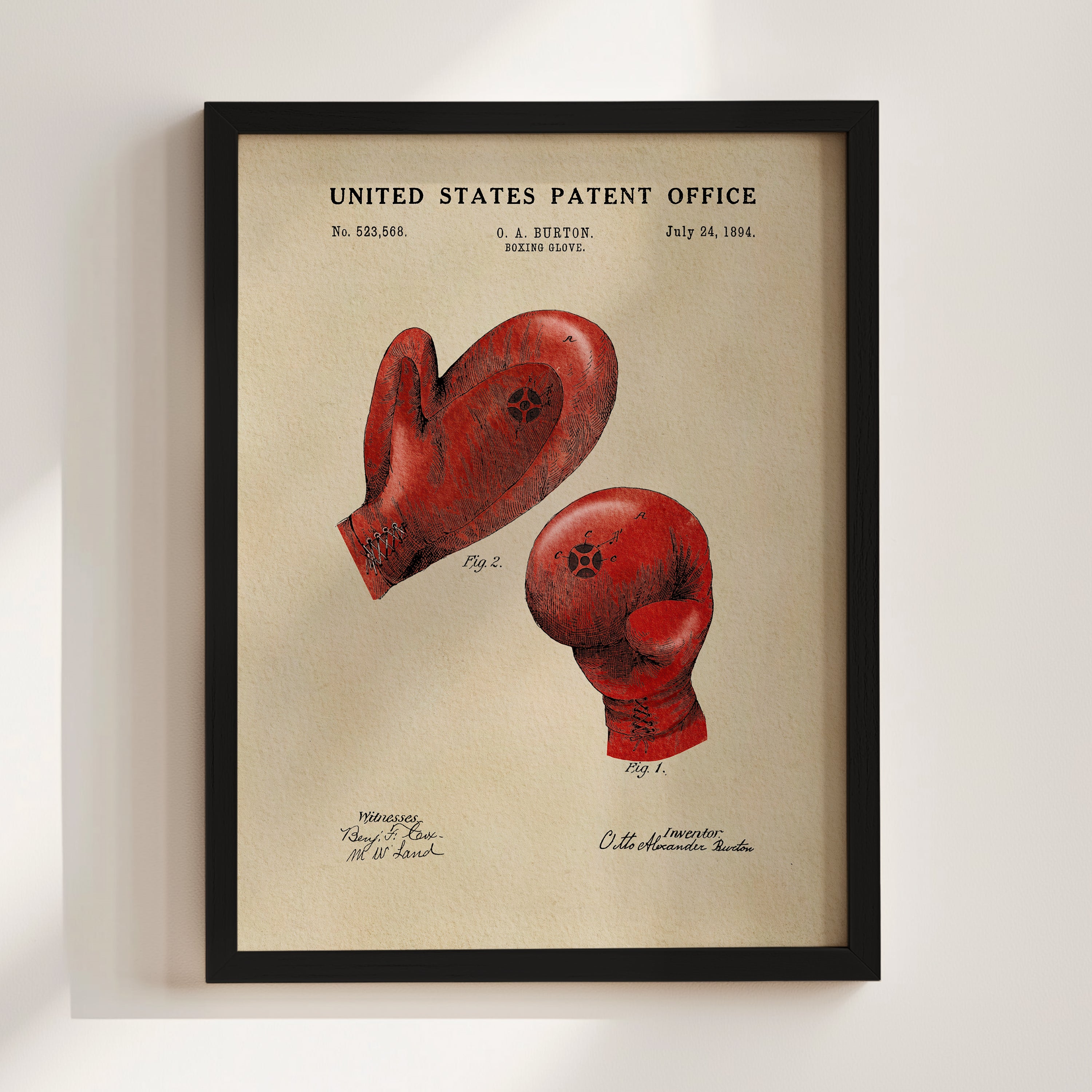 The image is a framed print of a red boxing glove with a patent application from the United States Patent Office dated July 24, 1884.