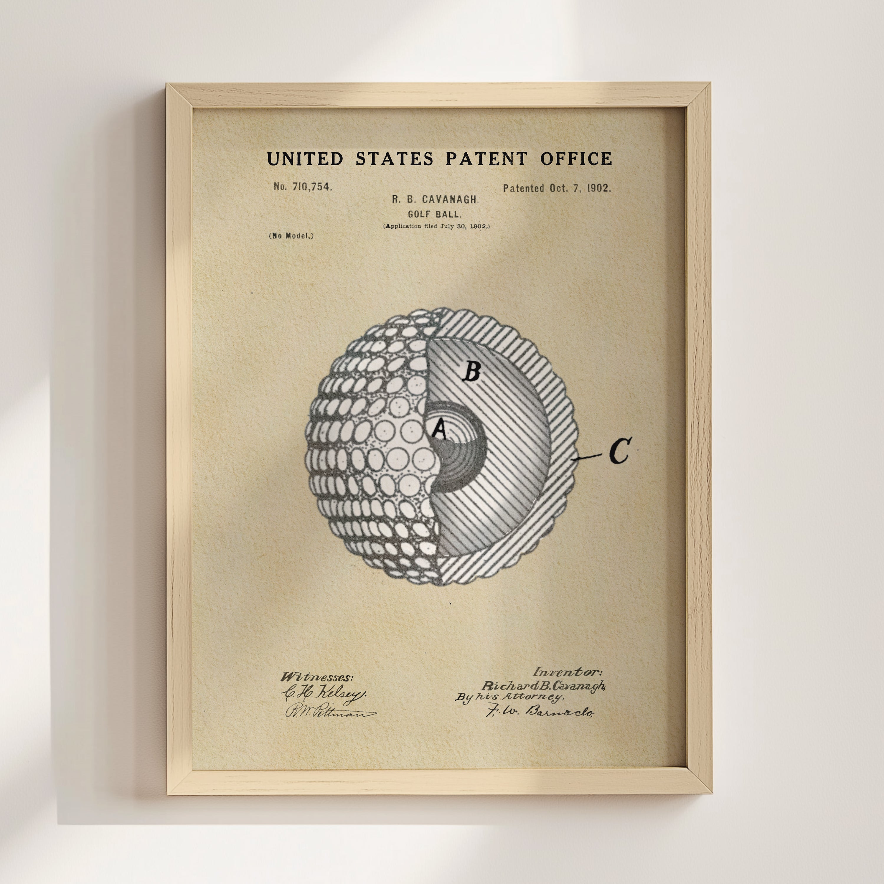 The image is a framed patent drawing depicting a golf ball with a cross-section view, showing the inner structure of the ball.