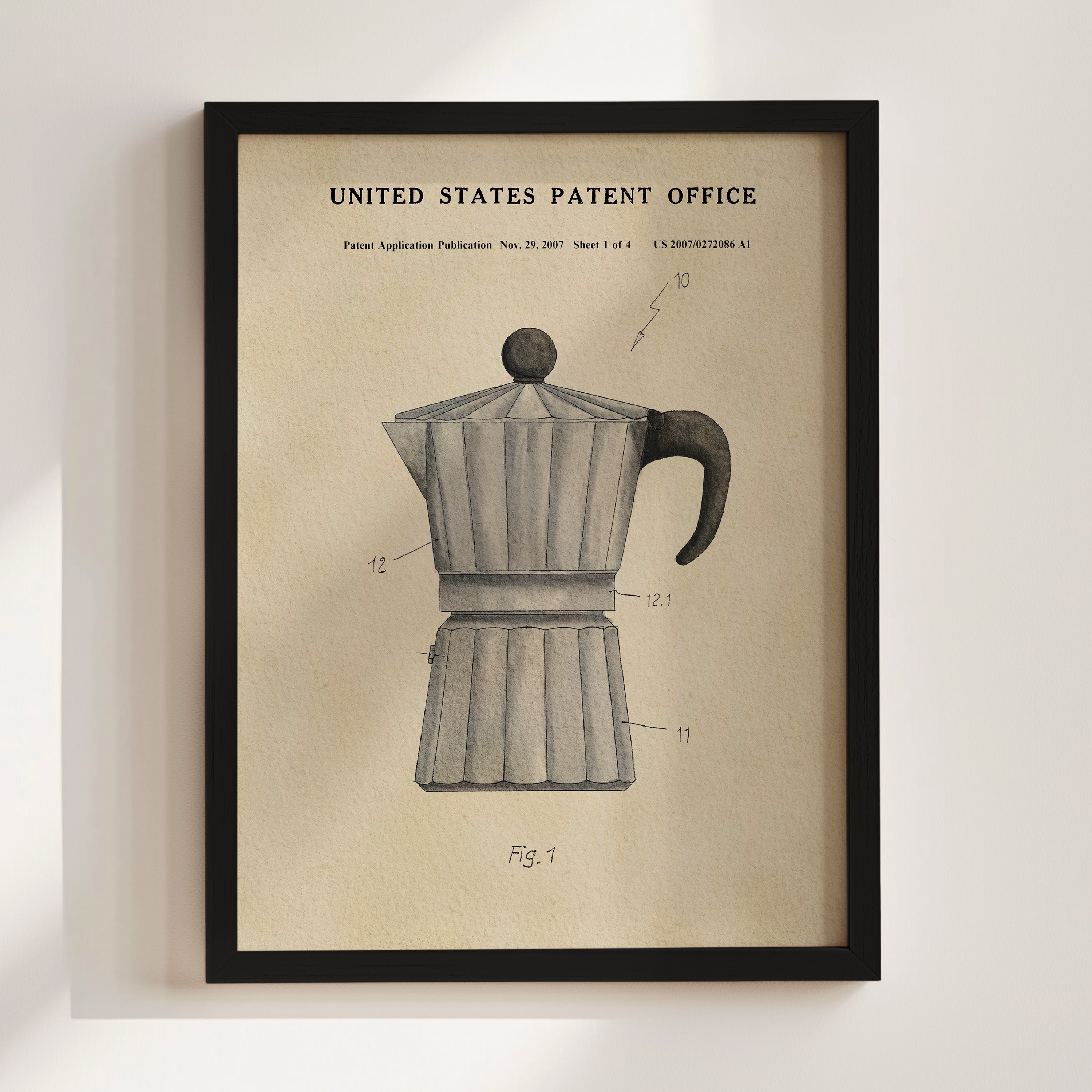 The image is a framed vintage patent drawing of a coffee maker, depicting the design and features of the device.