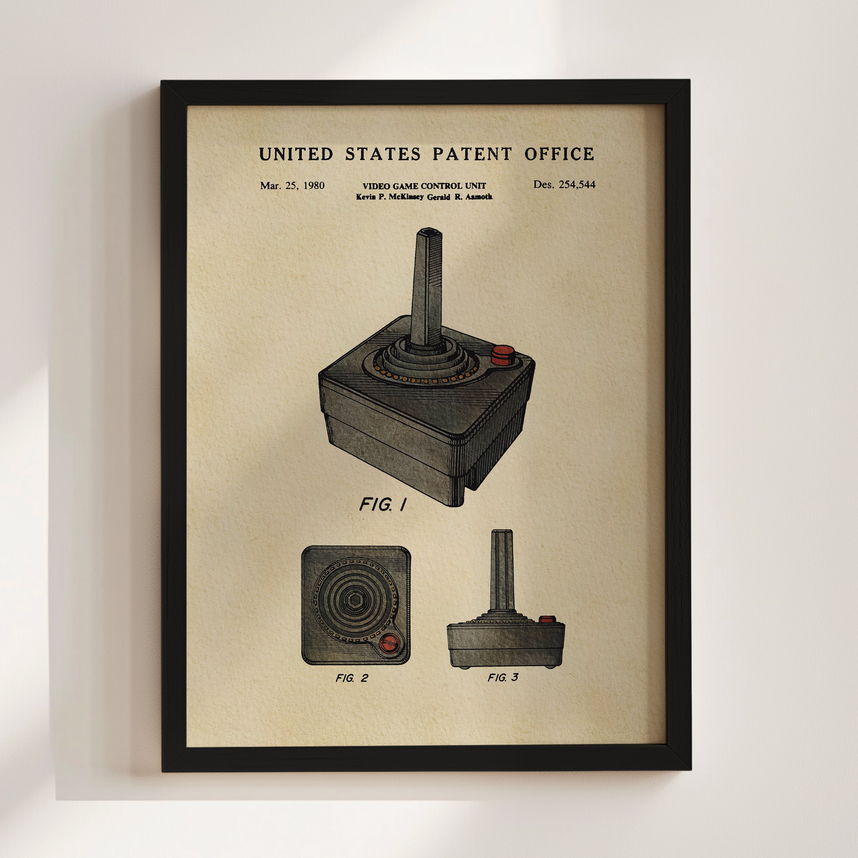 The image is a framed vintage-style patent drawing of a joystick, depicting the joystick in three different views.