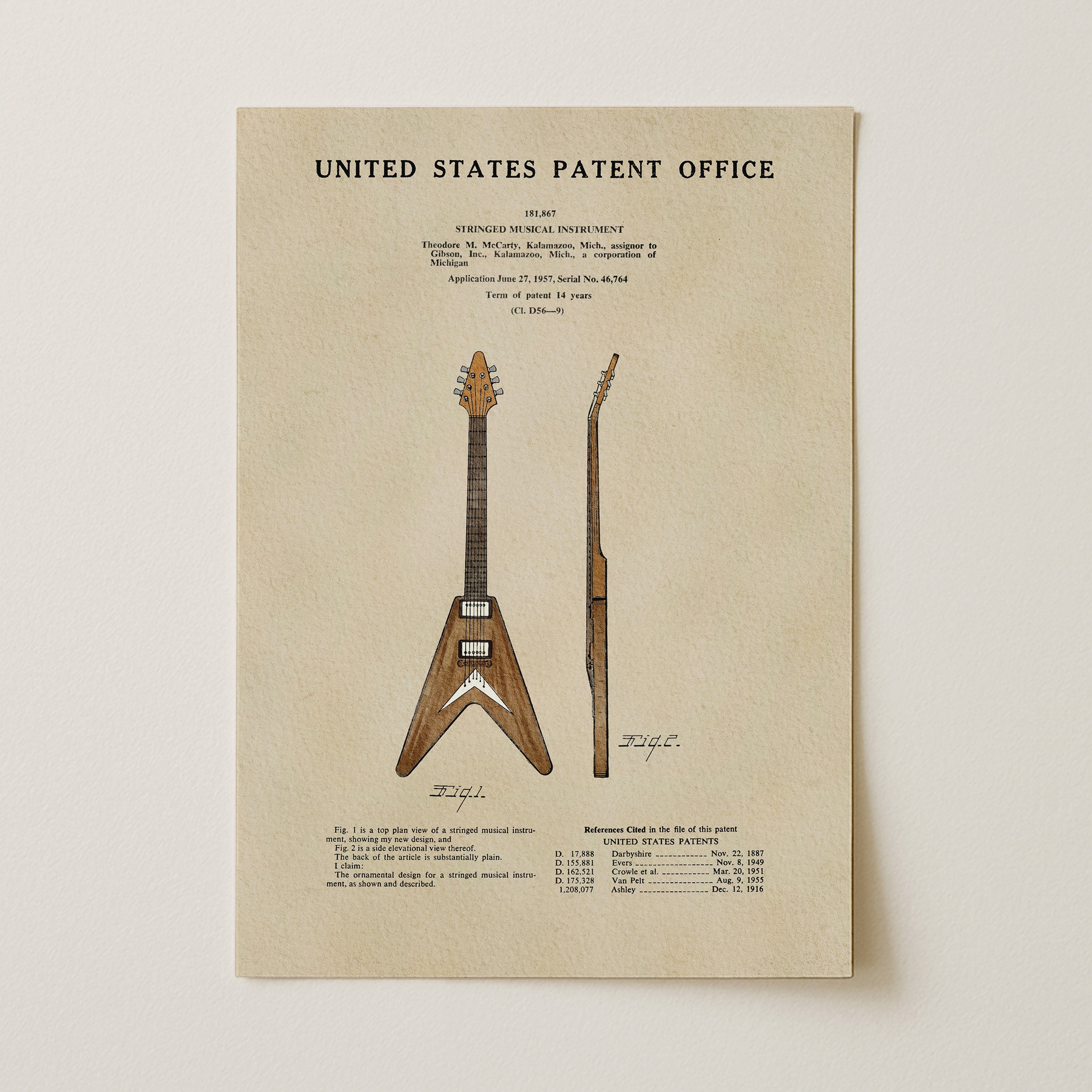 The image is a patent illustration of a guitar, depicting a V-shaped body with a long neck and a flat top.