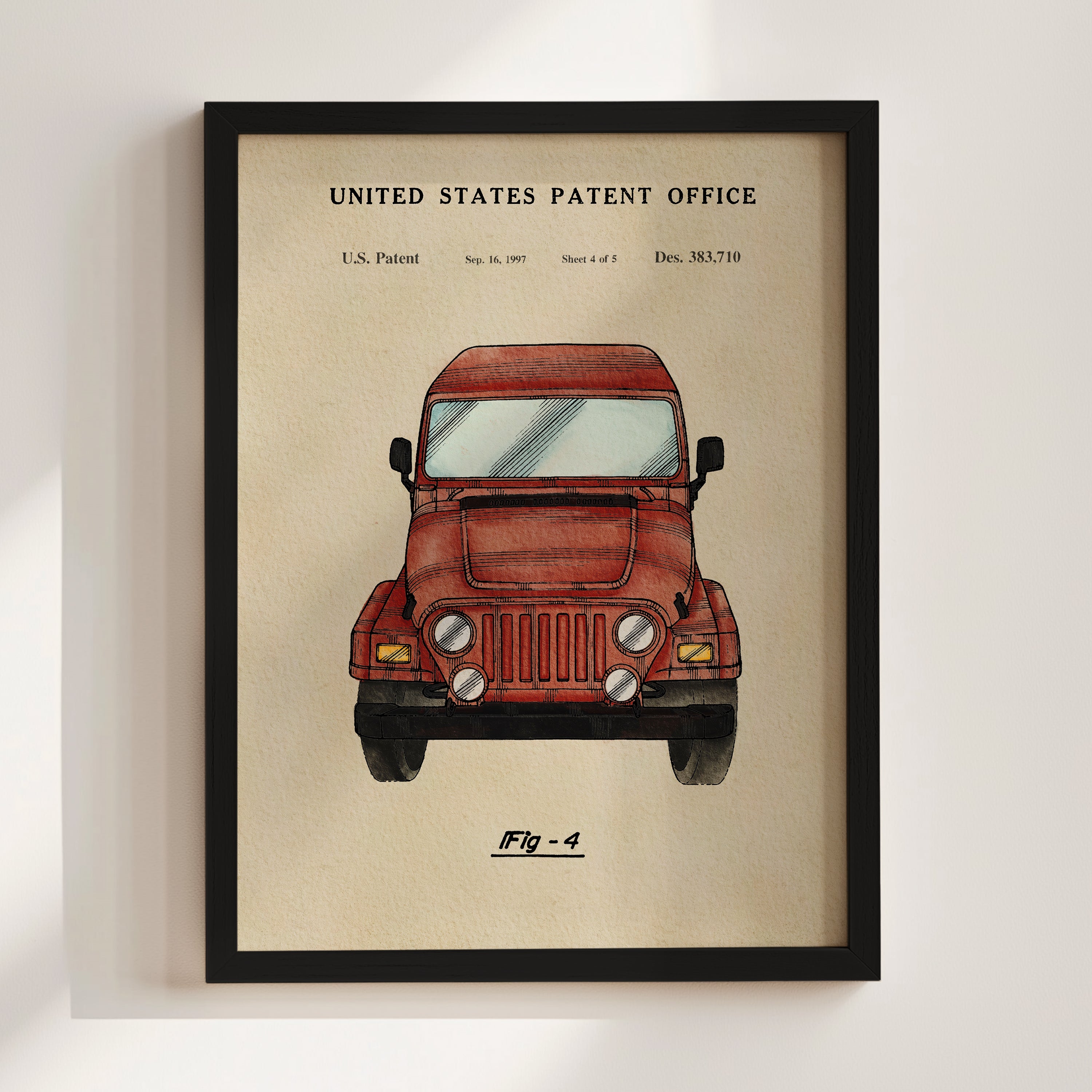 The image is a framed print of a red jeep, depicting a vehicle design with a focus on its front grille and headlights.