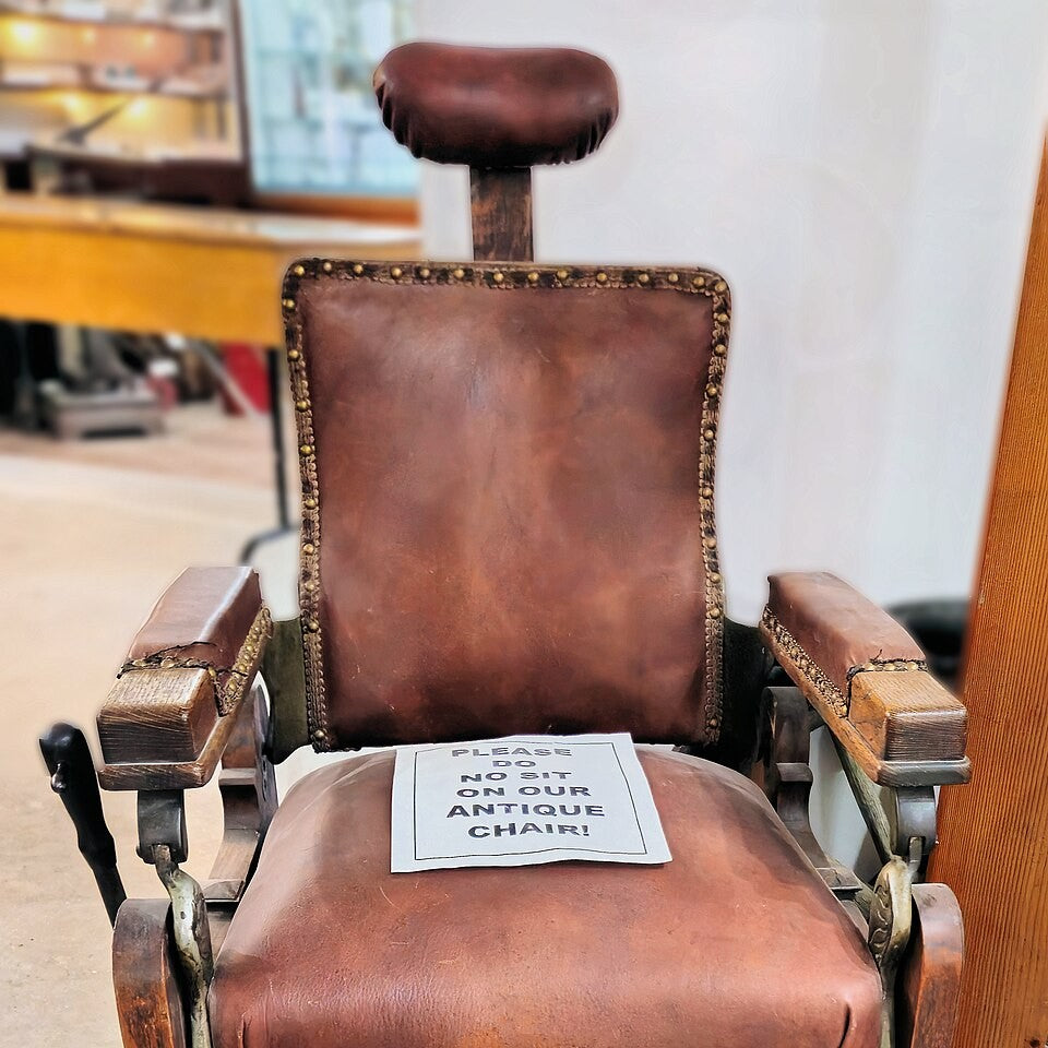 An antique leather barber chair