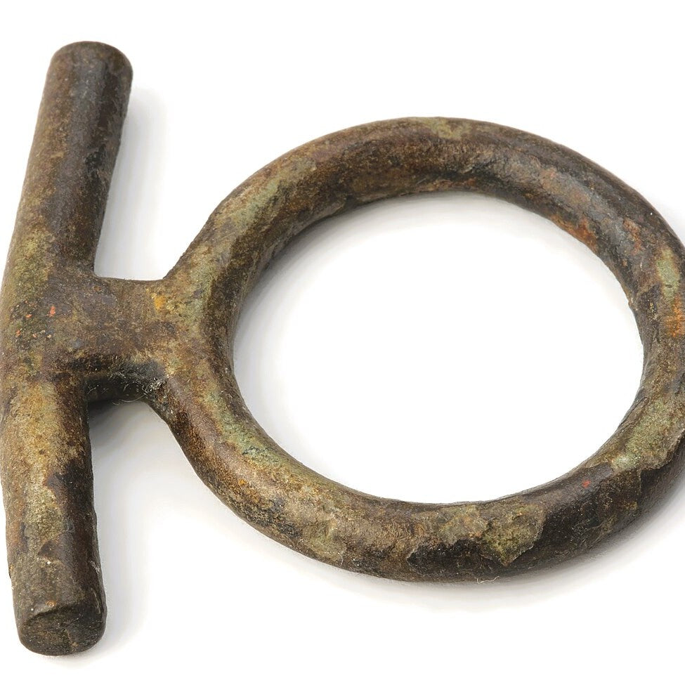 An antique bronze horse bridle bit