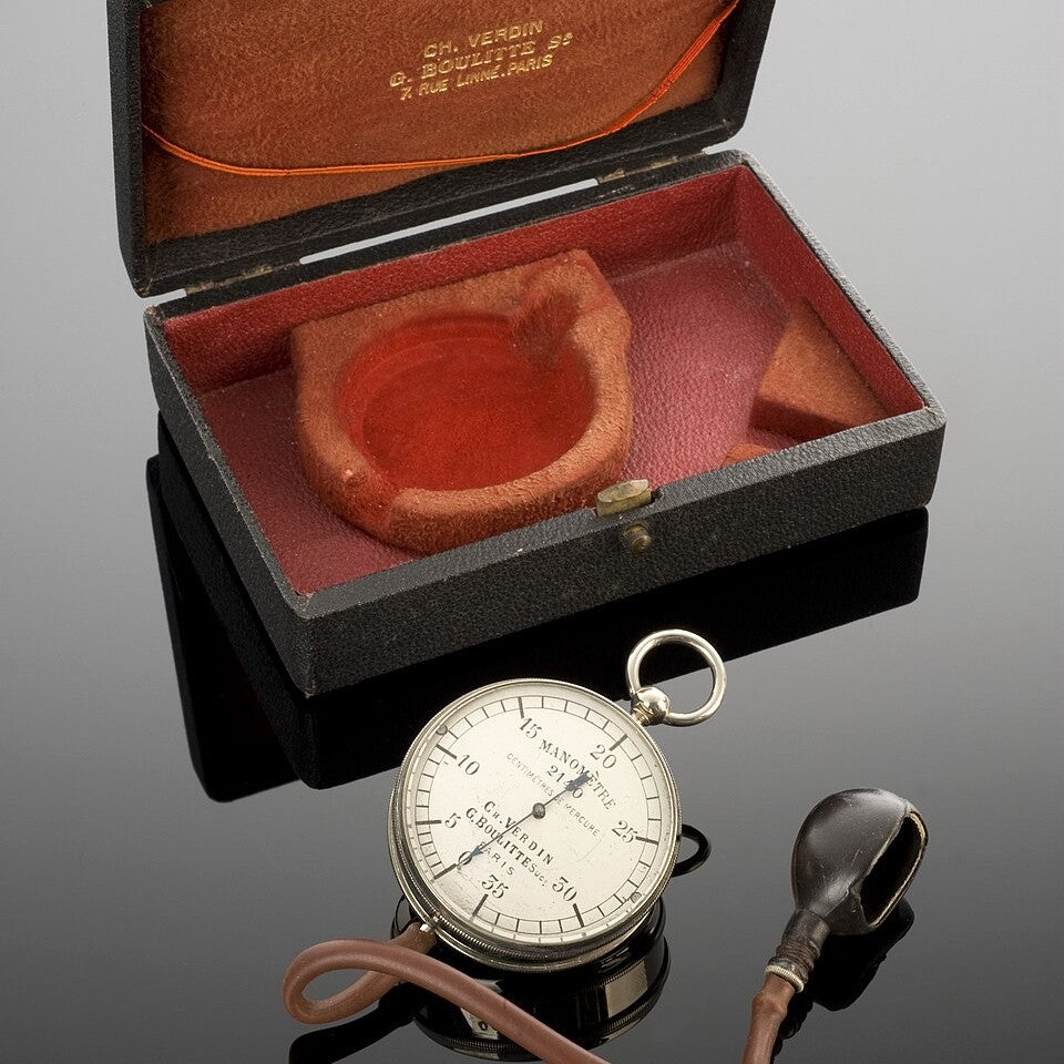 An antique Potain sphygmomanometer with its case