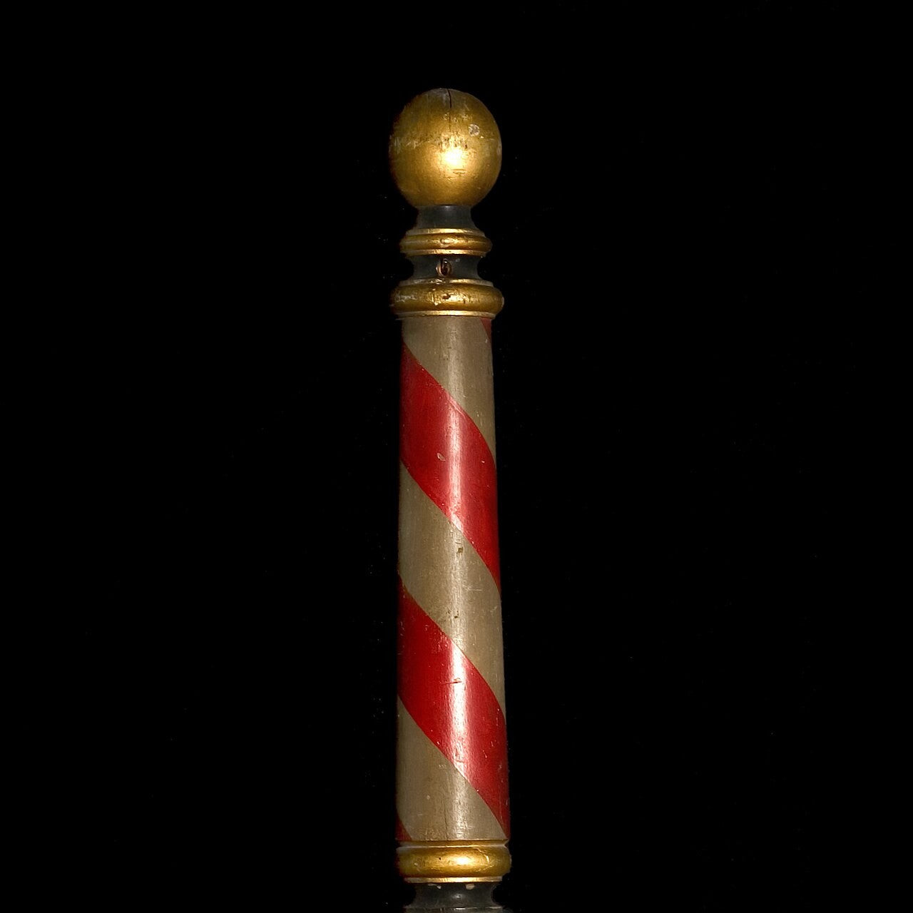 An antique striped barber pole