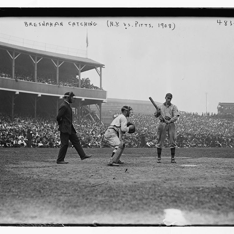 A catcher in early protective gear, 1908 baseball game