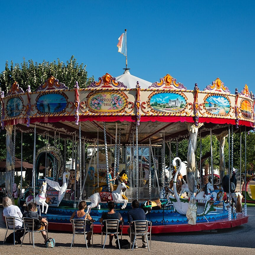 A colorful carousel with painted horses