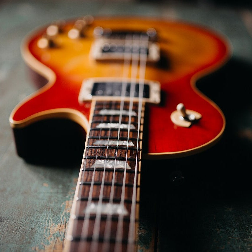 A close-up of an electric guitar's pickups