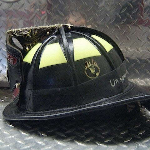 A black leather firefighter helmet