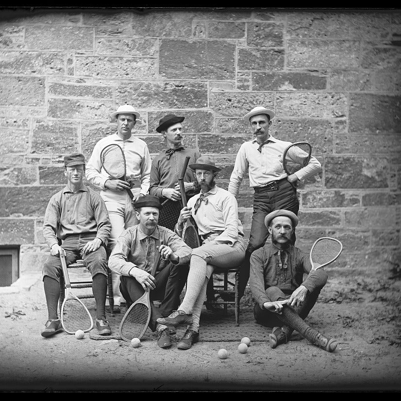 1890s lawn tennis team holding wooden racquets