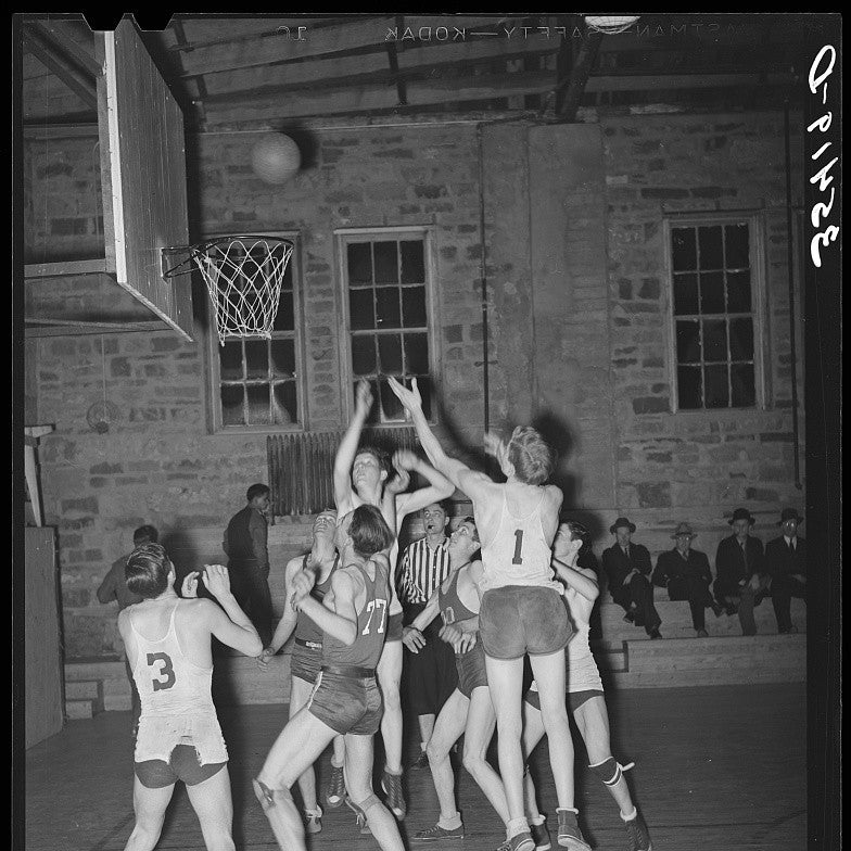 A 1940 indoor basketball game in progress
