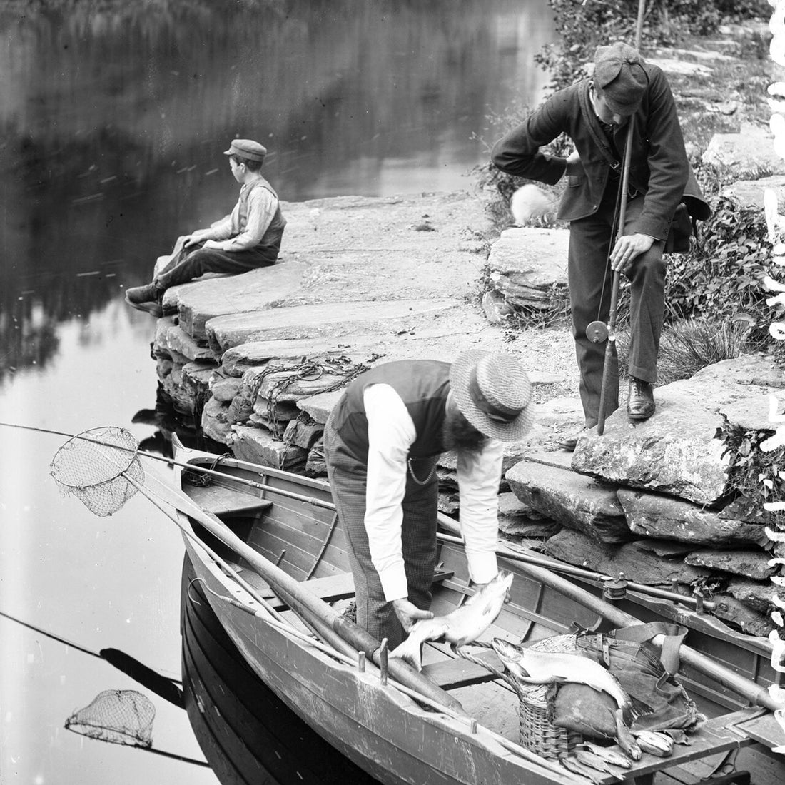 A vintage salmon fishing scene with a creel