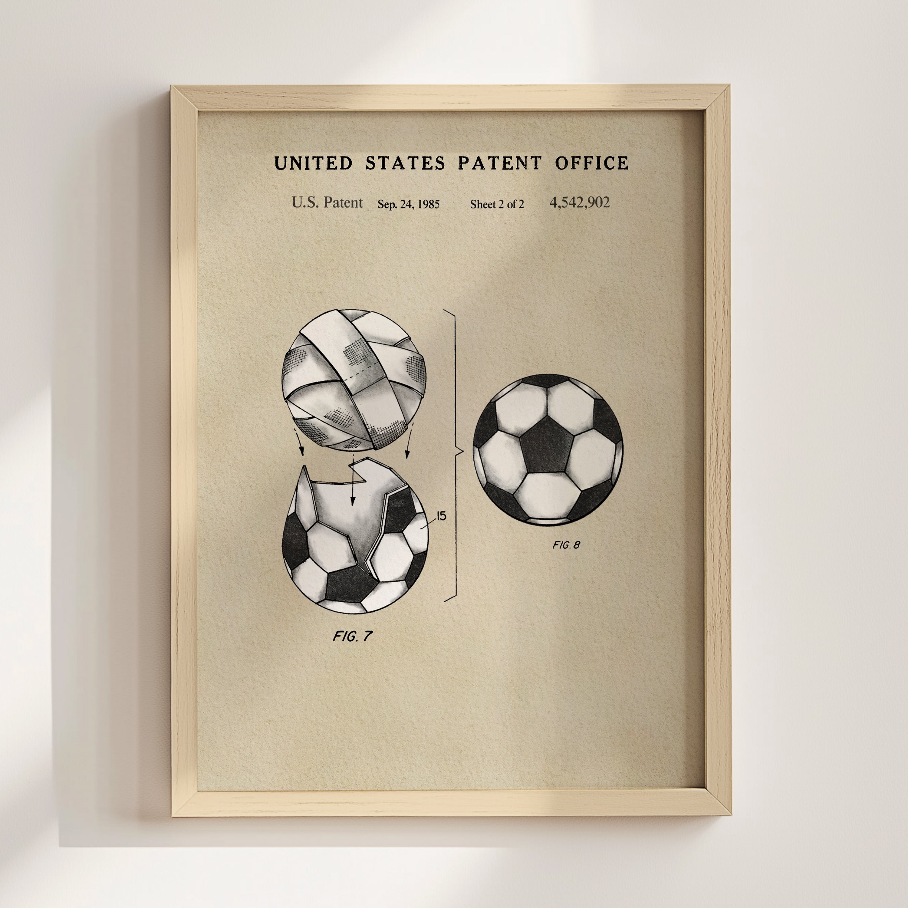 The image is a framed patent drawing depicting a soccer ball with a unique design, likely inspired by the patent filing of the same design.