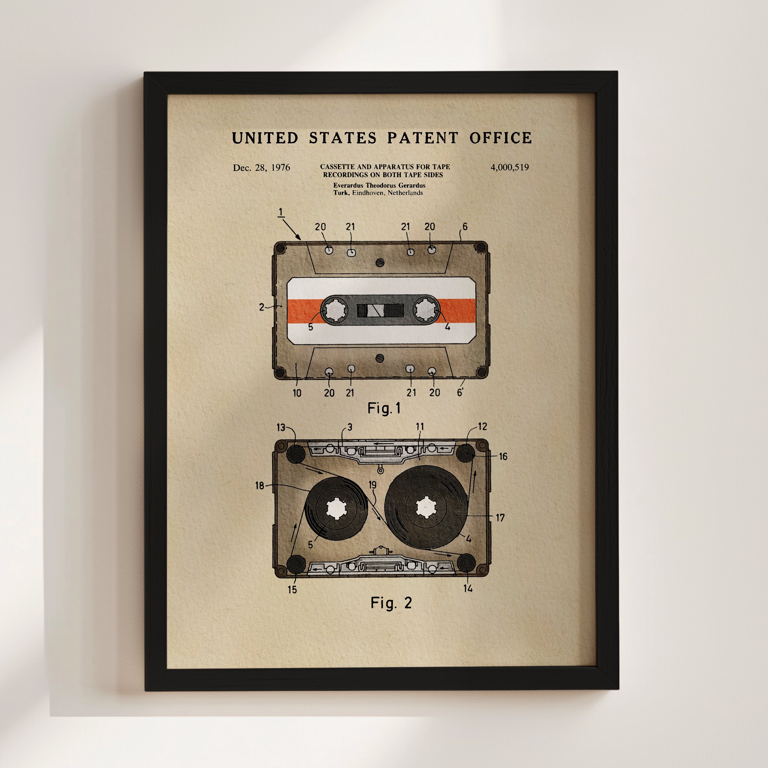 The image is a framed patent drawing depicting a cassette tape and a tape recorder, both with a focus on their design and features.