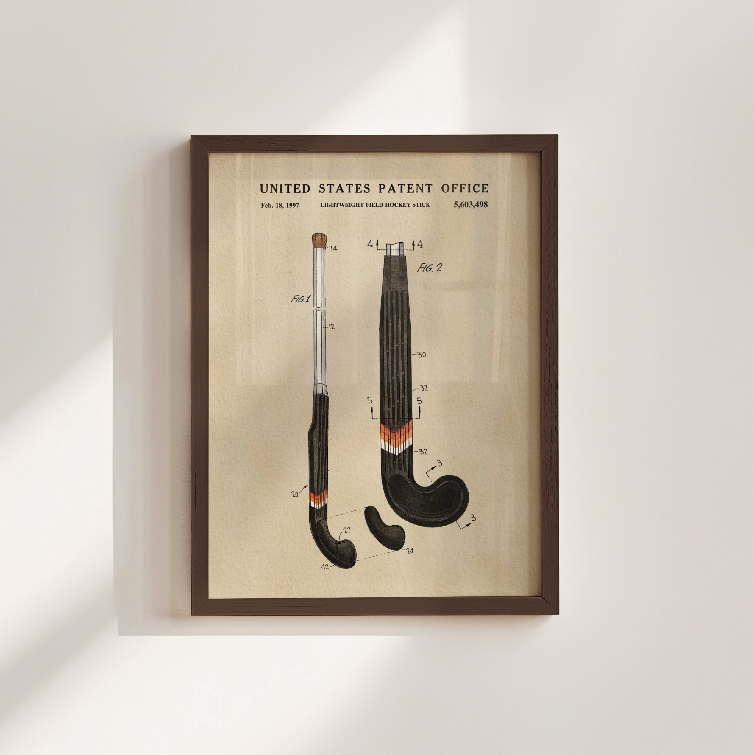 The image is a framed patent drawing depicting two hockey sticks with detailed technical drawings and labels.
