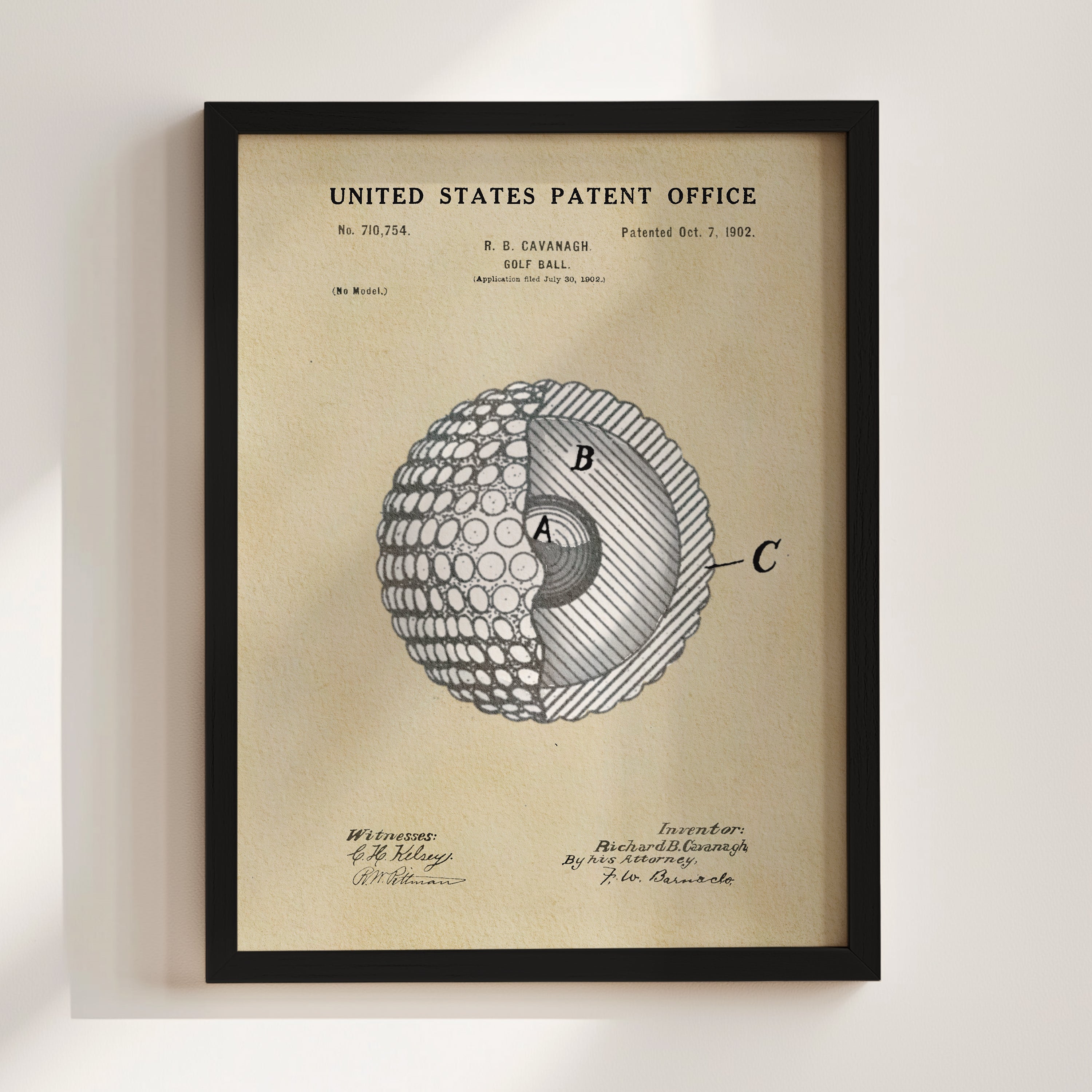 The image is a framed patent drawing depicting a golf ball with a cross-section view, showing the inner structure of the ball.
