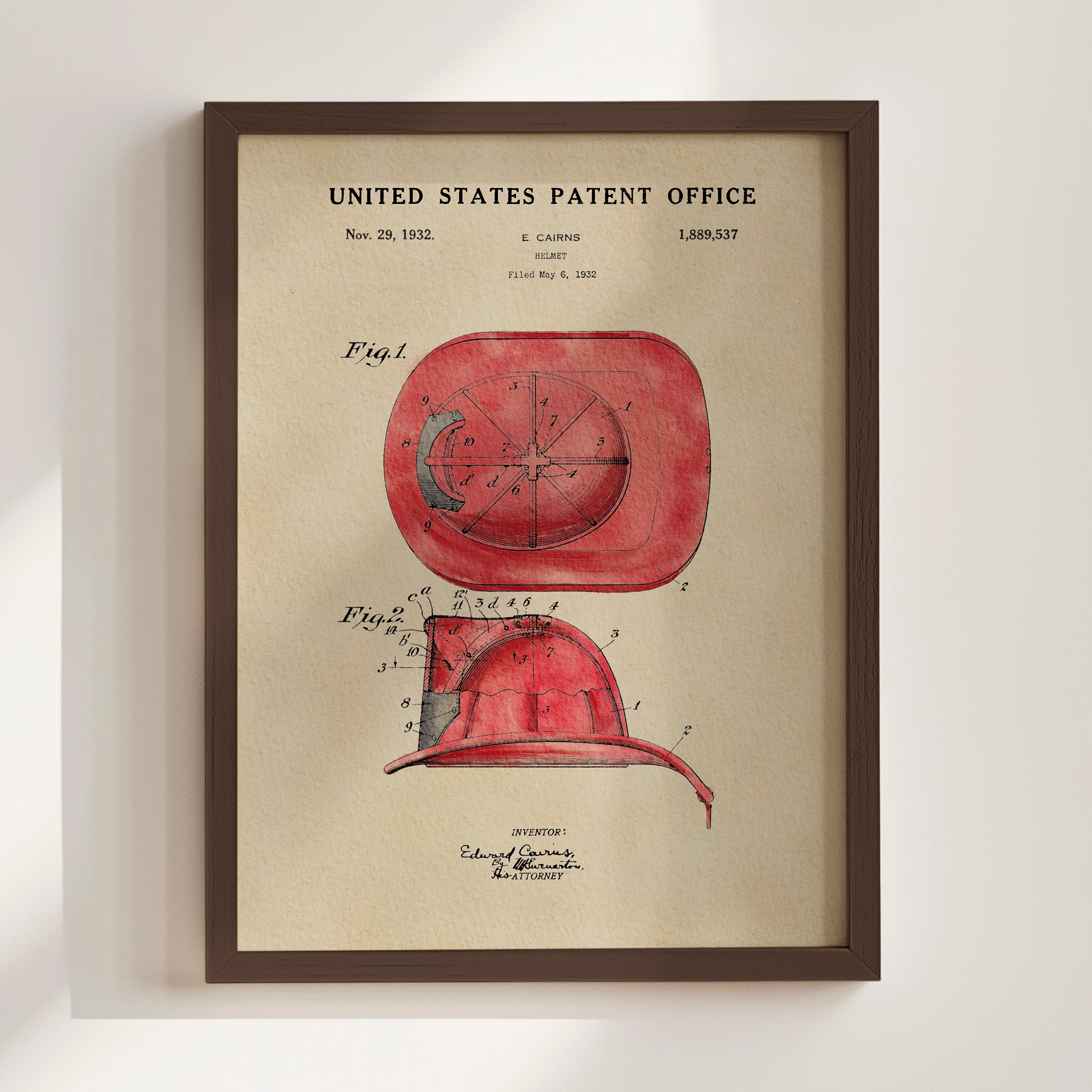 The image is a framed patent drawing of a red fire helmet, depicting the design and features of the helmet.