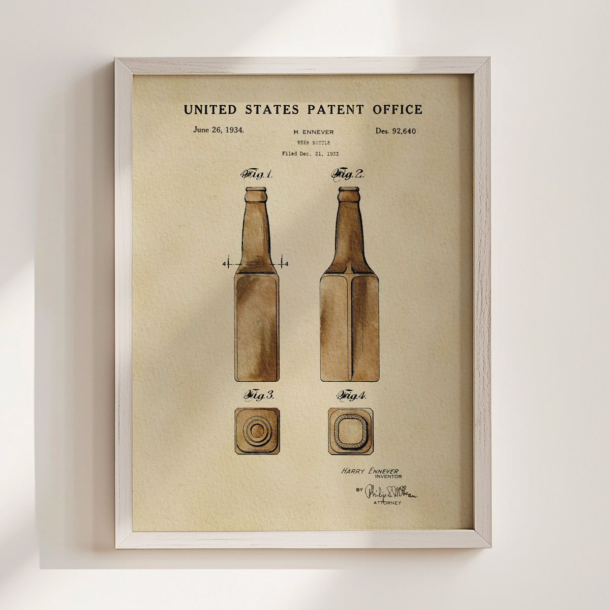The image is a framed patent drawing depicting two bottles, with the text "United States Patent Office" and "Harvey Ennever" at the top.